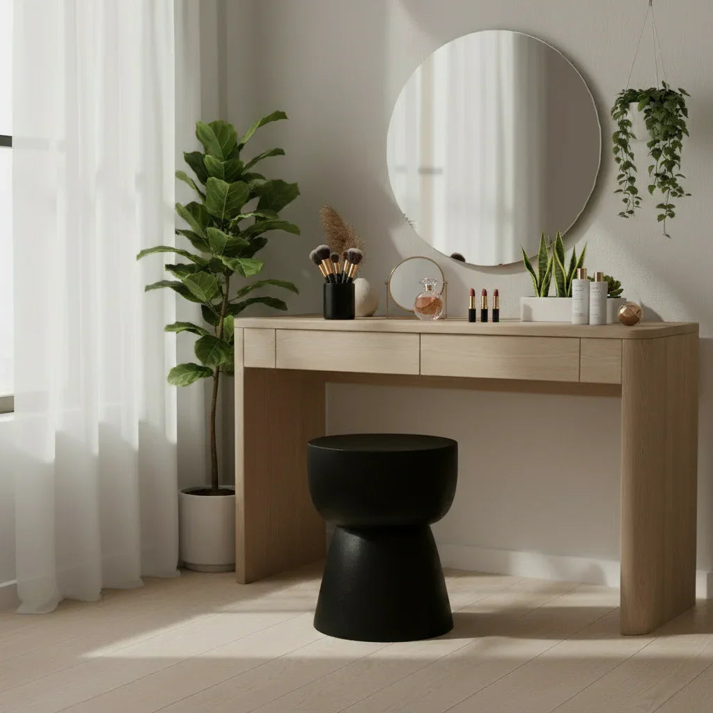 Handmade wooden vanity table with round mirror, modern black stool, plants, and décor, Kayu Living