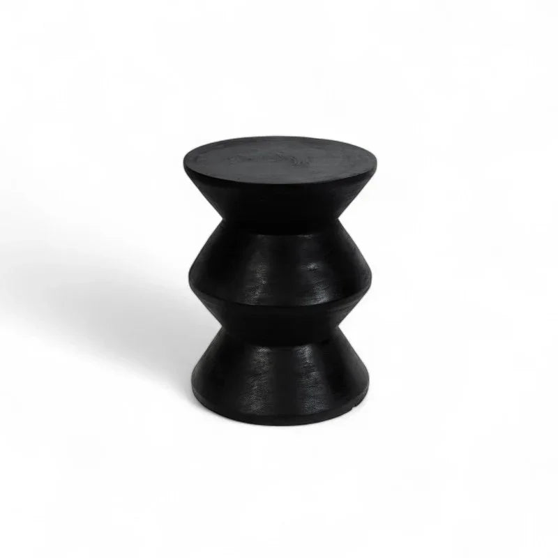Handmade black wooden stool with sculptural hourglass shape, Kayu Living furniture