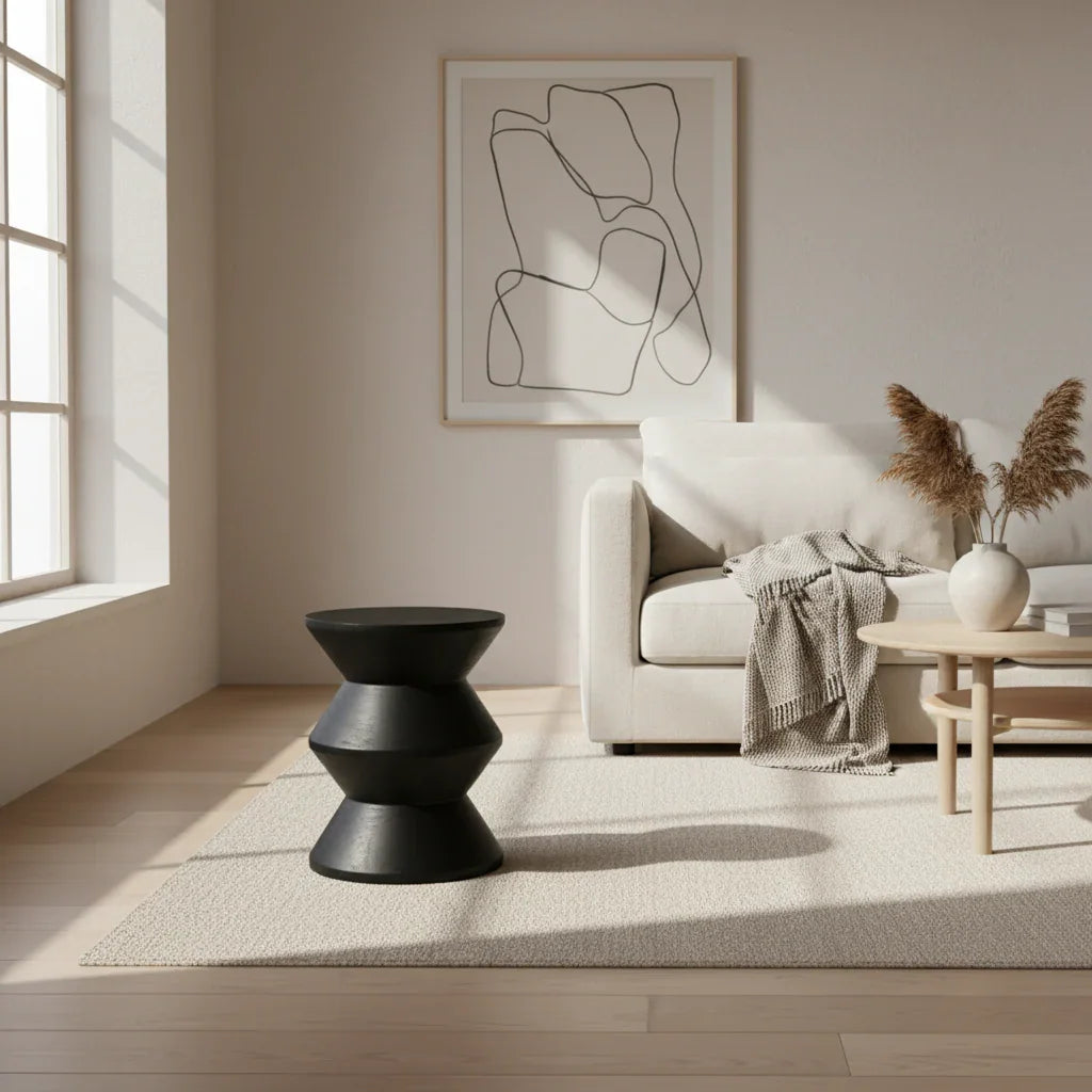 Modern living room with a black hand-crafted Kayu Living side table, neutral sofa, and minimalist decor
