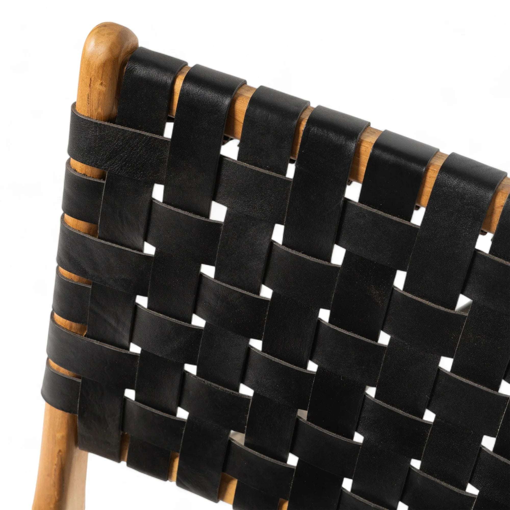 Handmade dining chair with woven black leather backrest and natural wood frame by Kayu Living