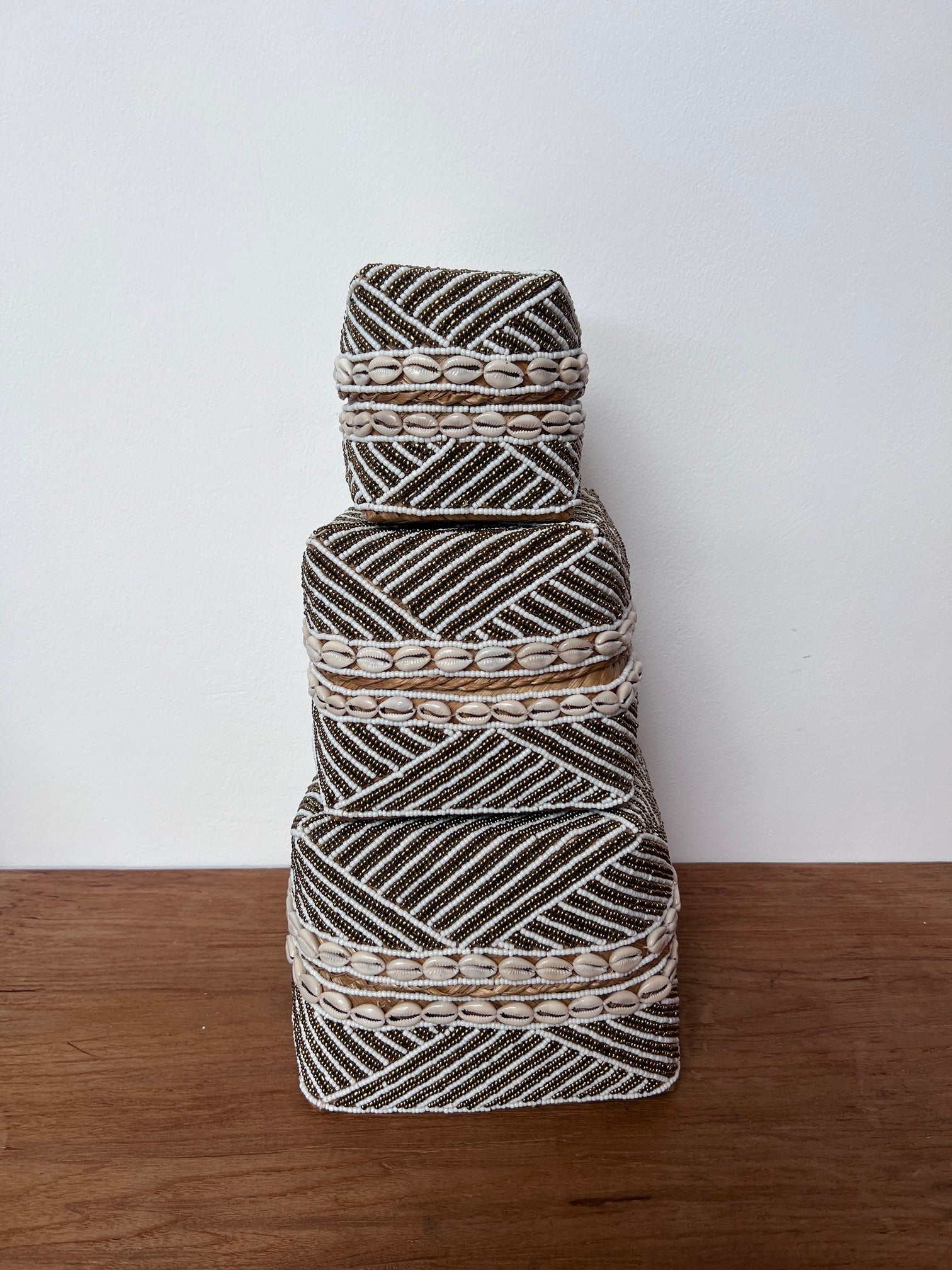 Decorative basket with geometric pattern on a white background