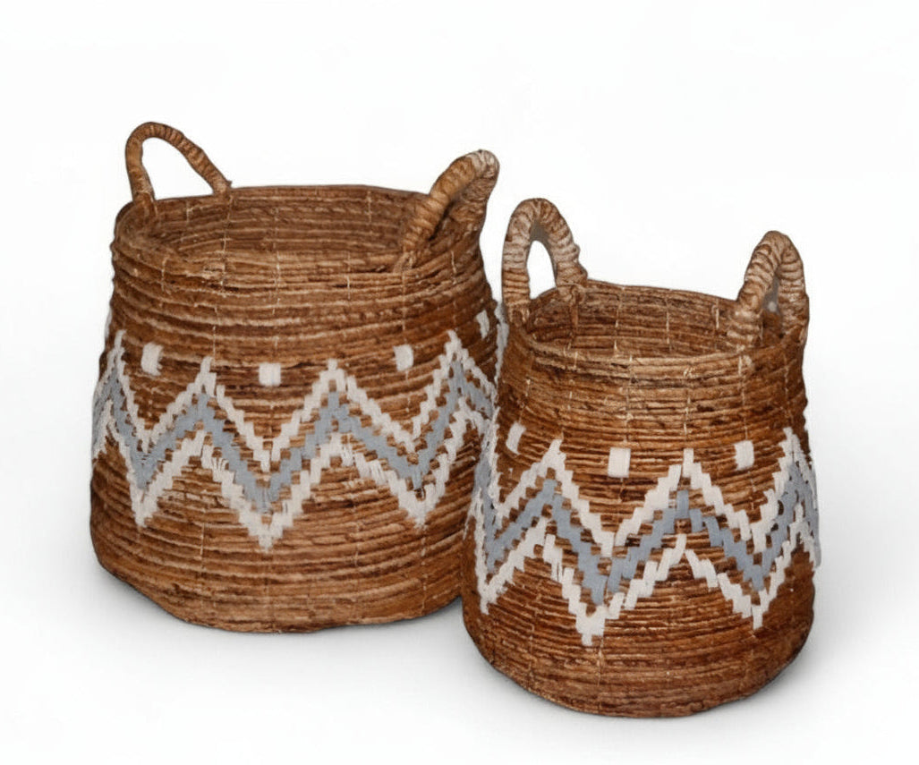 Two brown banana cord baskets with white geometric patterns, Crafted from natural materials.