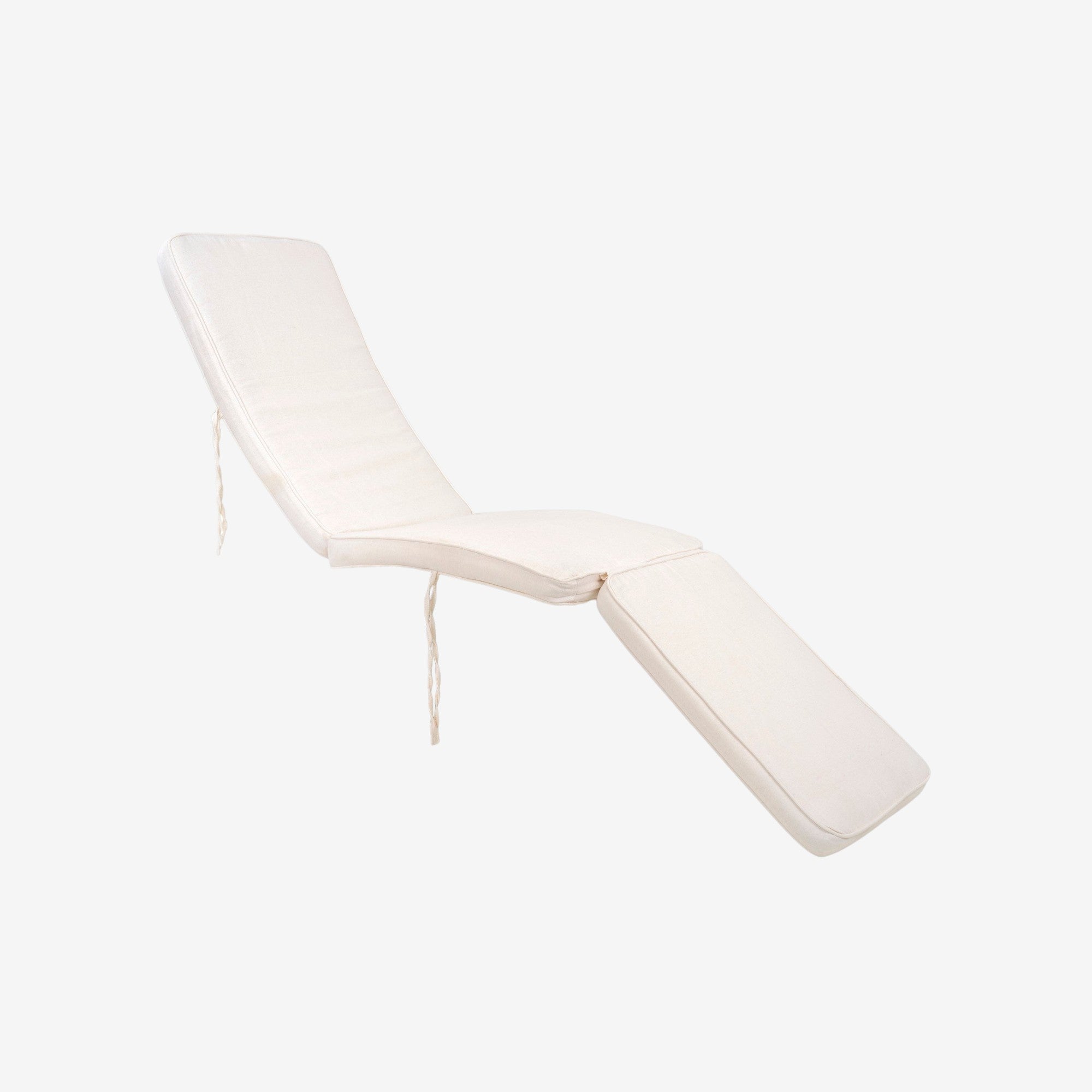 Kayu Living Arrecife adjustable reclining deck chair with plush white cotton cushion. Natural teak frame.