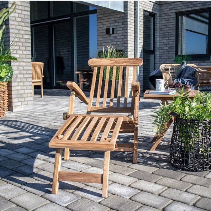 Kayu Living Arrecife natural teak deck chair with adjustable back and footrest, outdoor patio furniture.