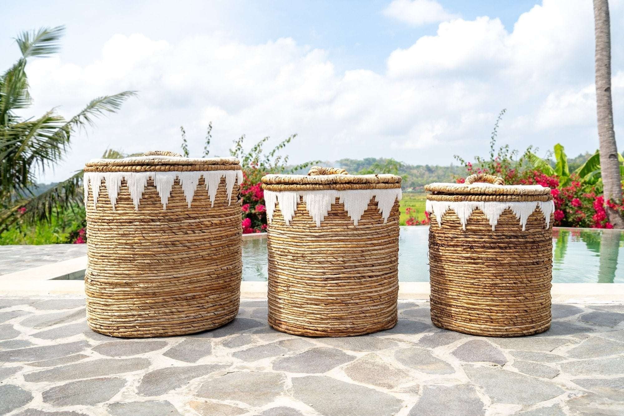 Kayu Living natural banana cord storage baskets with lids and white embroidery detail. Set of three sizes.