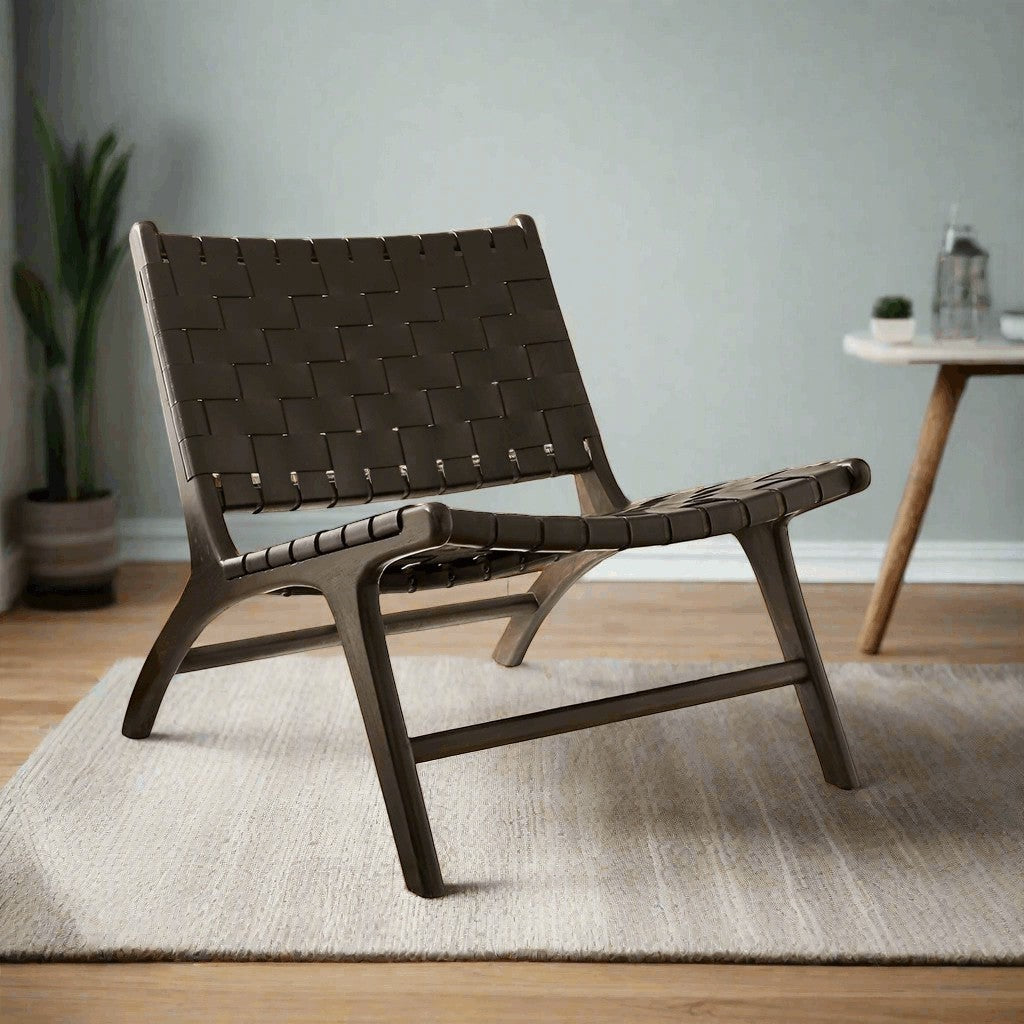 Kayu Living black handwoven leather lounge chair with black teak frame, modern design for living room or office.