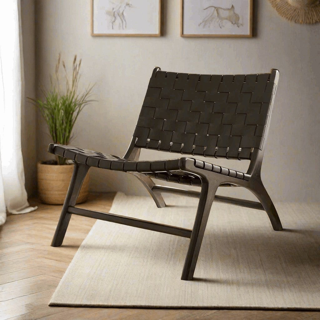 Kayu Living black handwoven leather lounge chair with black teak frame, modern design for living room or office.