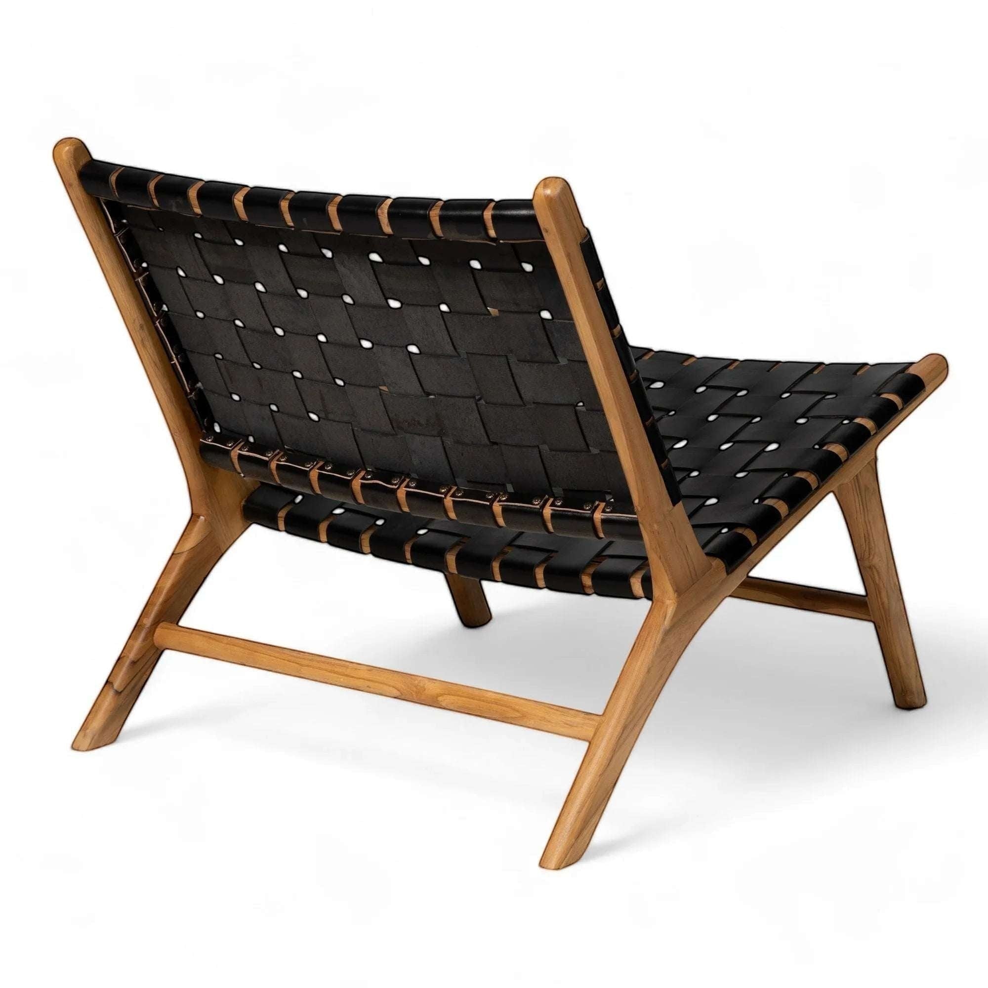 Kayu Living Umalas lounge chair with black handwoven leather seat and teak frame. Modern, minimalist design.