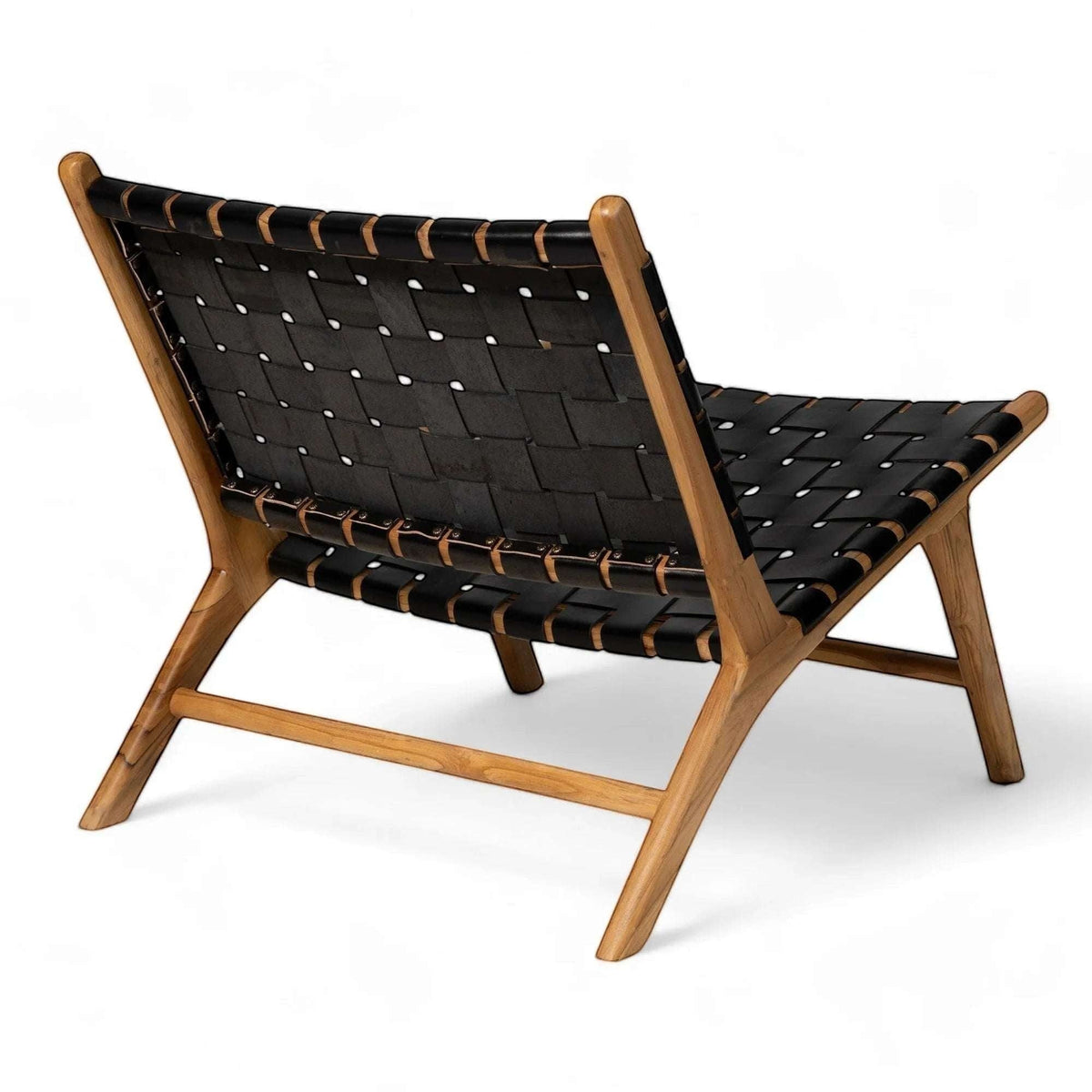 Kayu Living Umalas lounge chair with black handwoven leather seat and teak frame. Modern, minimalist design.