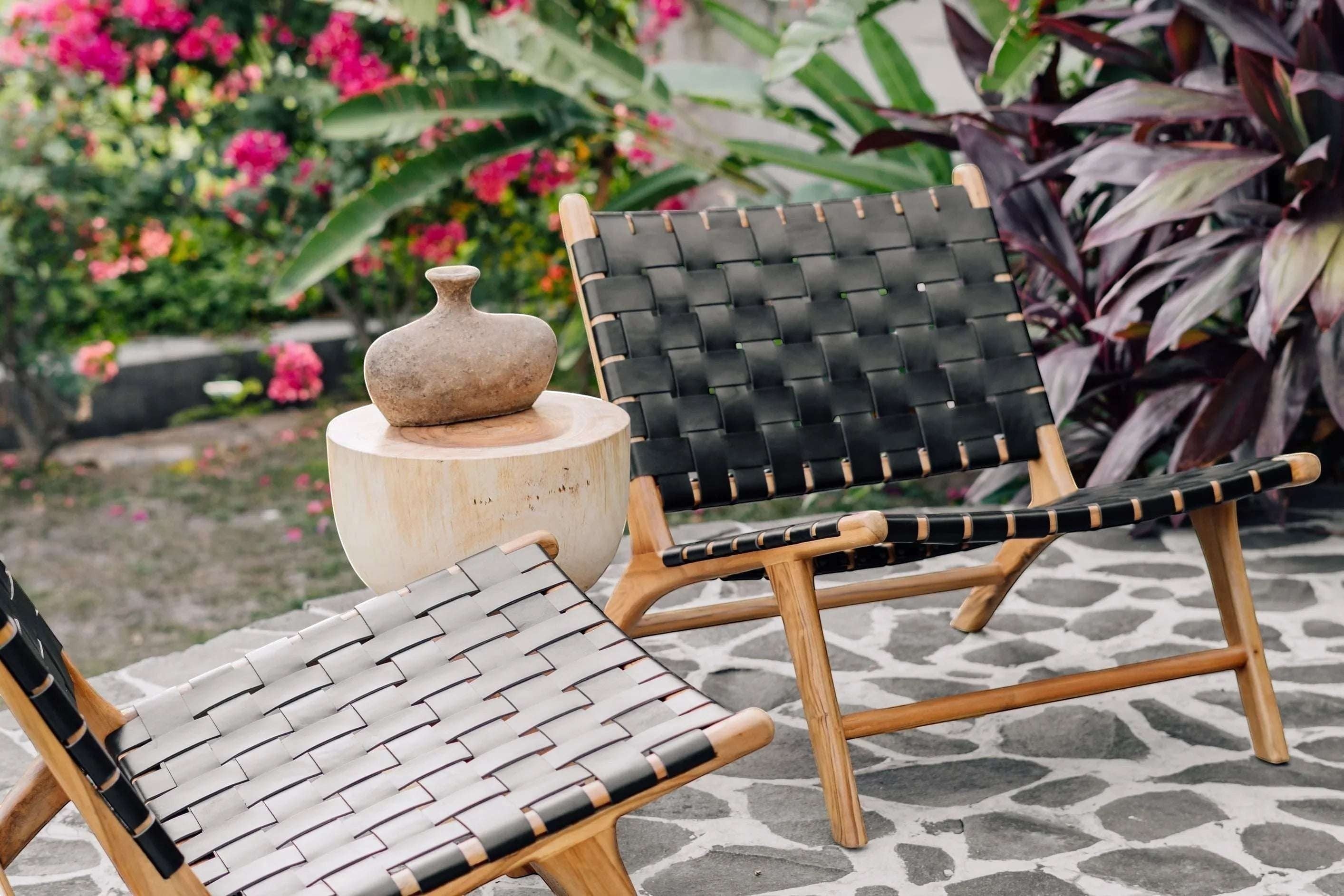 Kayu Living Umalas lounge chair with black handwoven leather seat and teak frame, perfect for indoor or outdoor relaxation.