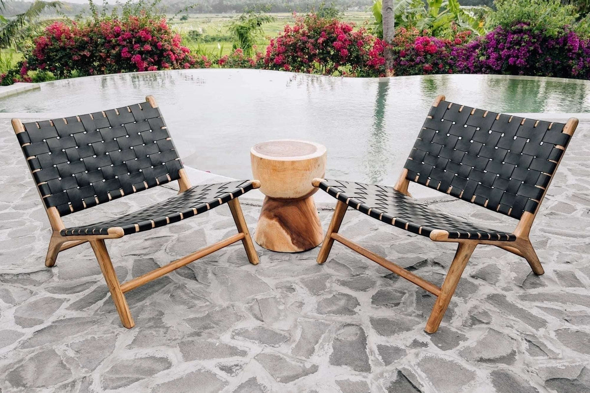 Kayu Living Umalas lounge chair with black handwoven leather seat and teak frame, modern design.