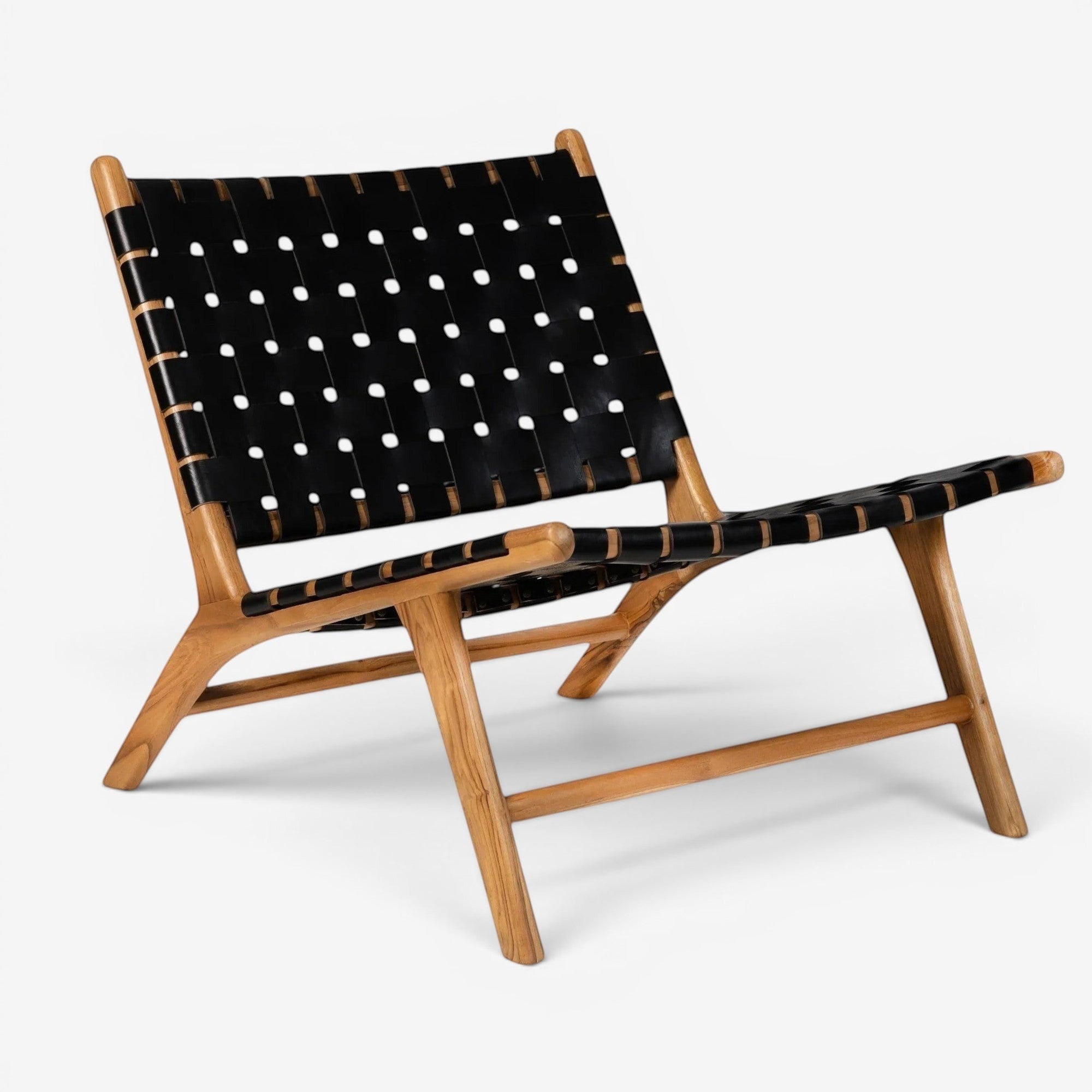 Kayu Living Umalas lounge chair with black handwoven leather seat and teak frame. Modern design, comfortable seating.