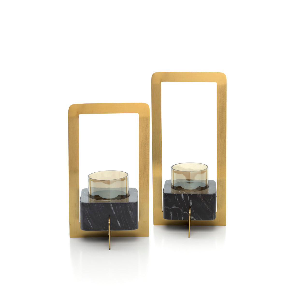 Kayu Living black marble and brass-gold candle holders with clear glass votives in a sculptural rectangular design.