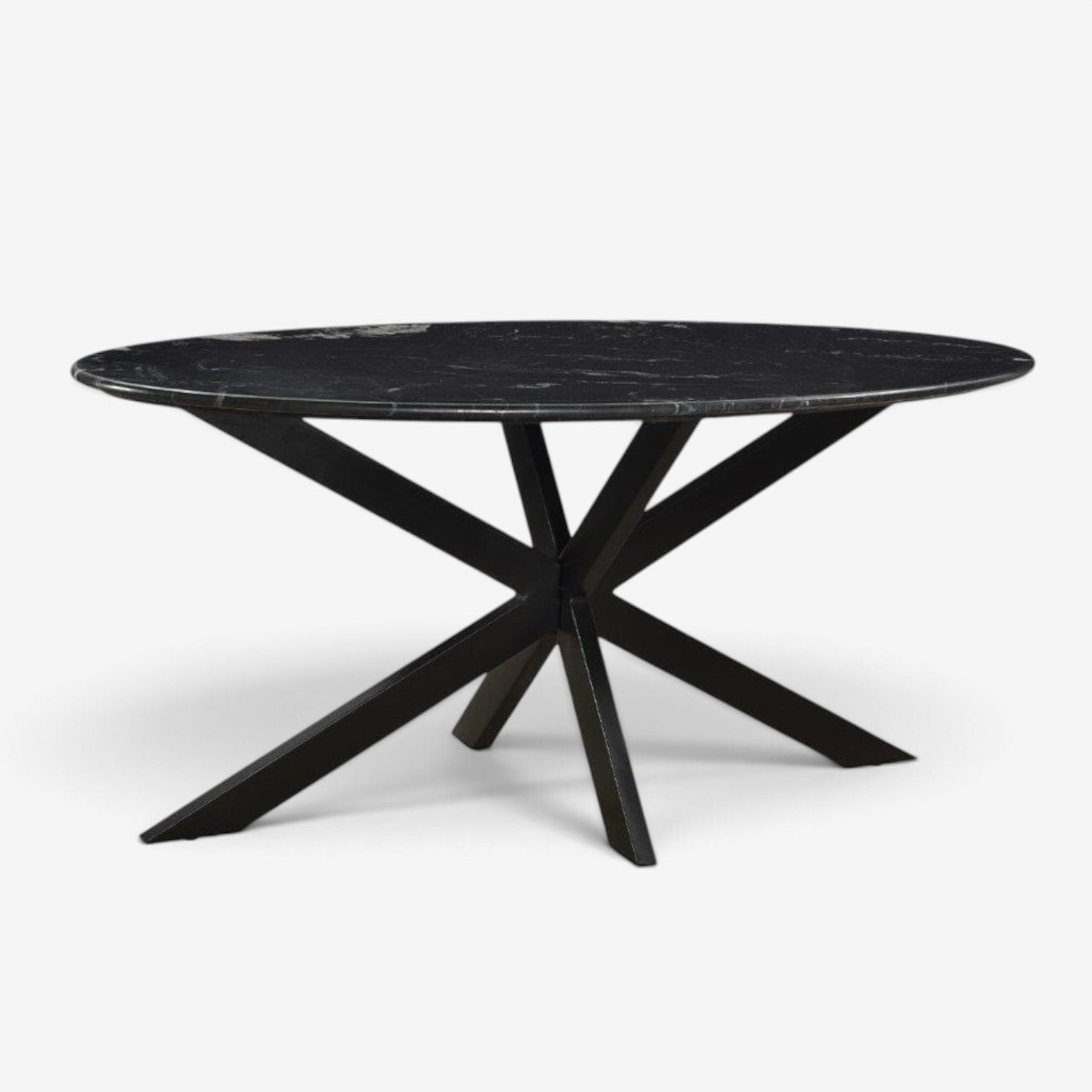 Kayu Living 180cm oval dining table with a black marble top and a striking black steel spider base