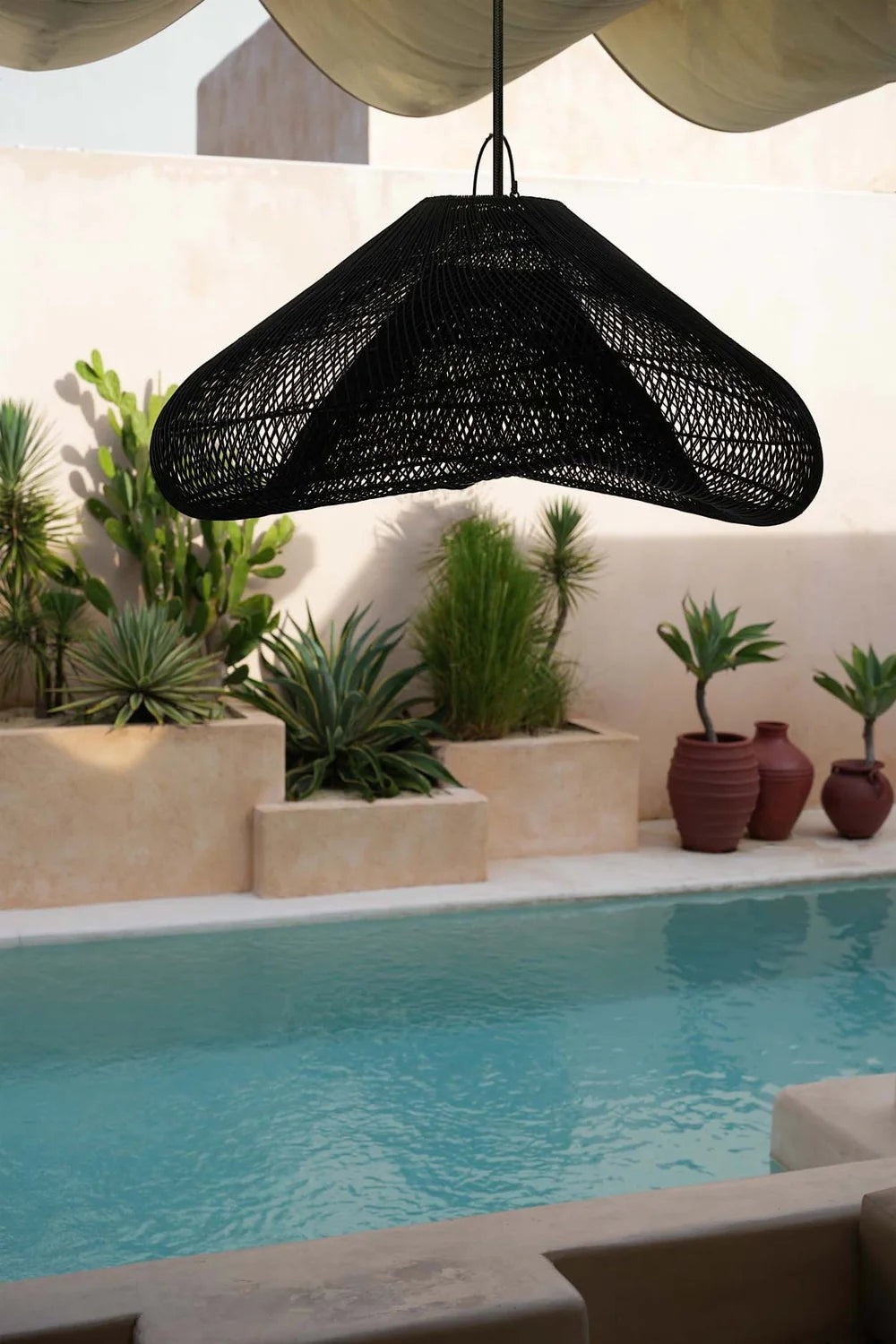 Kayu Living black oversized rattan pendant lamp with a sculptural, flowing form. XXL size.