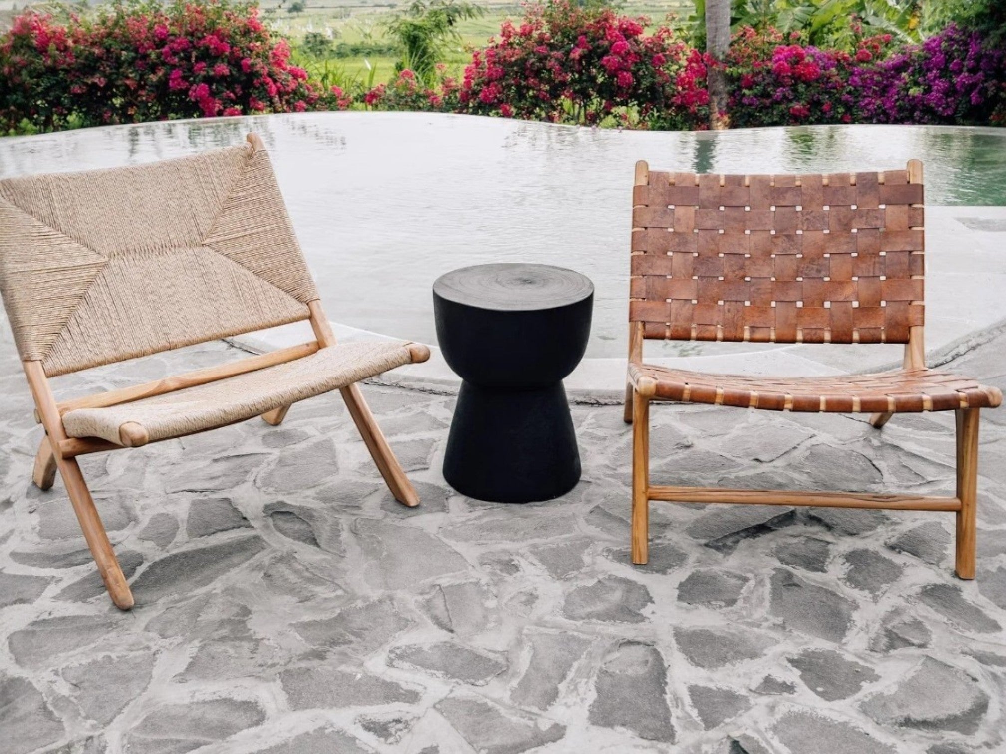 Kayu Living black cupped stool made from solid suar wood with a unique natural grain and rustic charm.