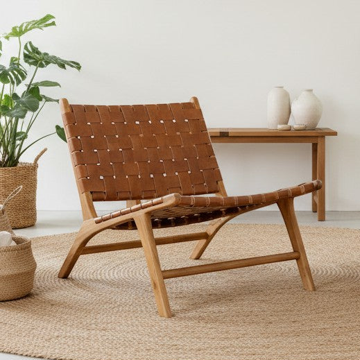 Kayu Living Sanur lounge chair with handwoven camel leather seat and teak frame.