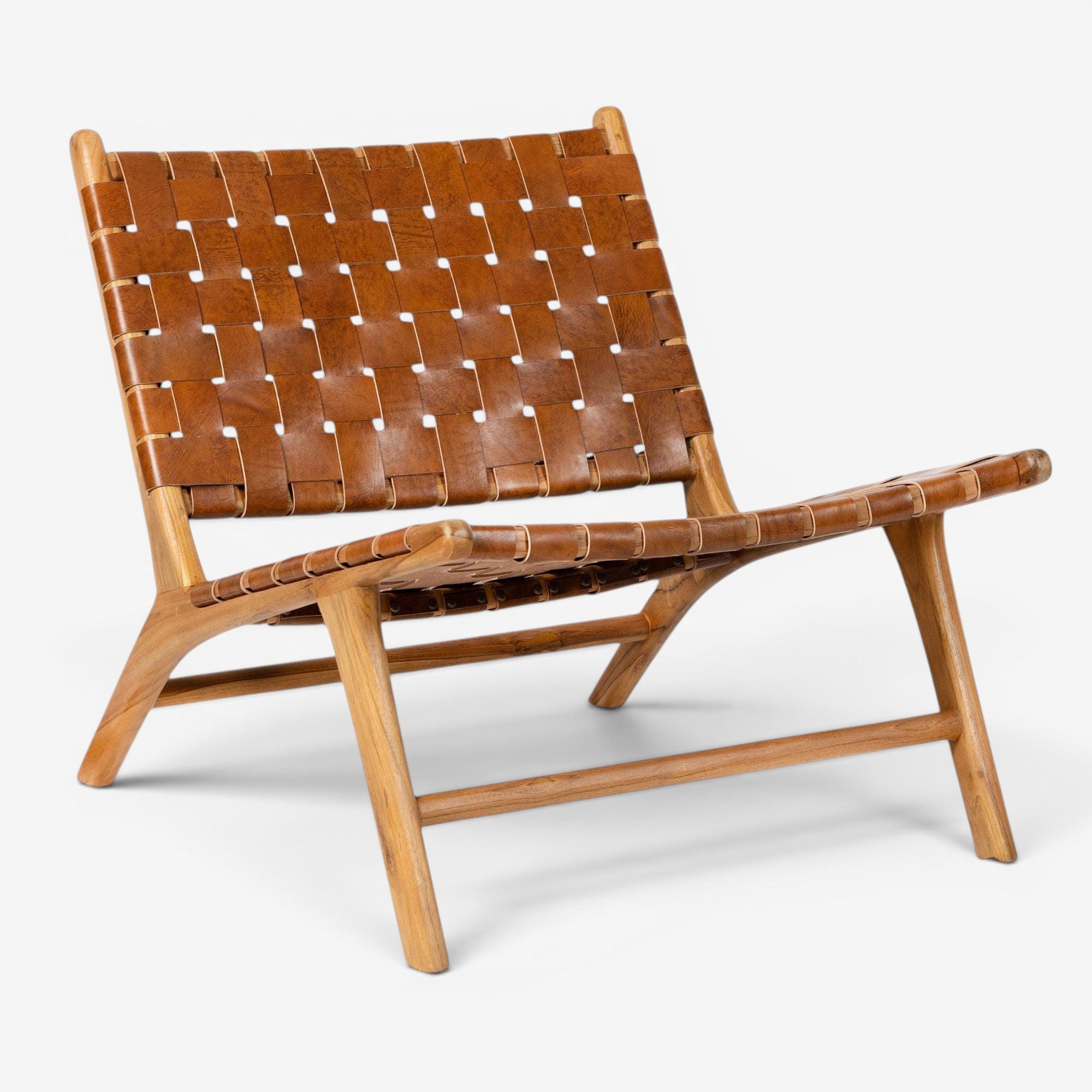 Kayu Living Sanur lounge chair with handwoven camel leather seat and teak frame. Modern, comfortable accent chair.