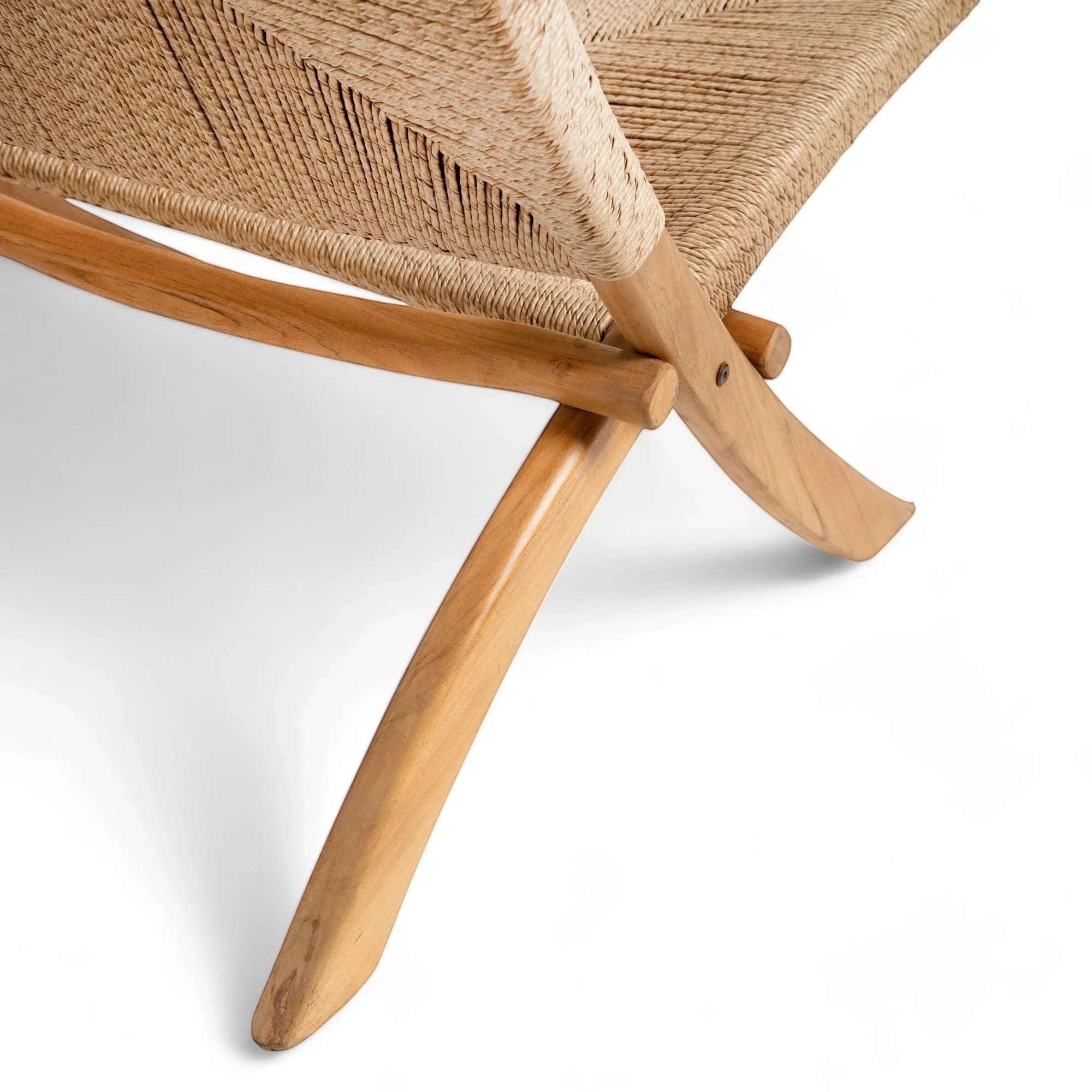 Kayu Living Cemagi foldable lounge chair with handwoven natural rope seat and teak wood frame.