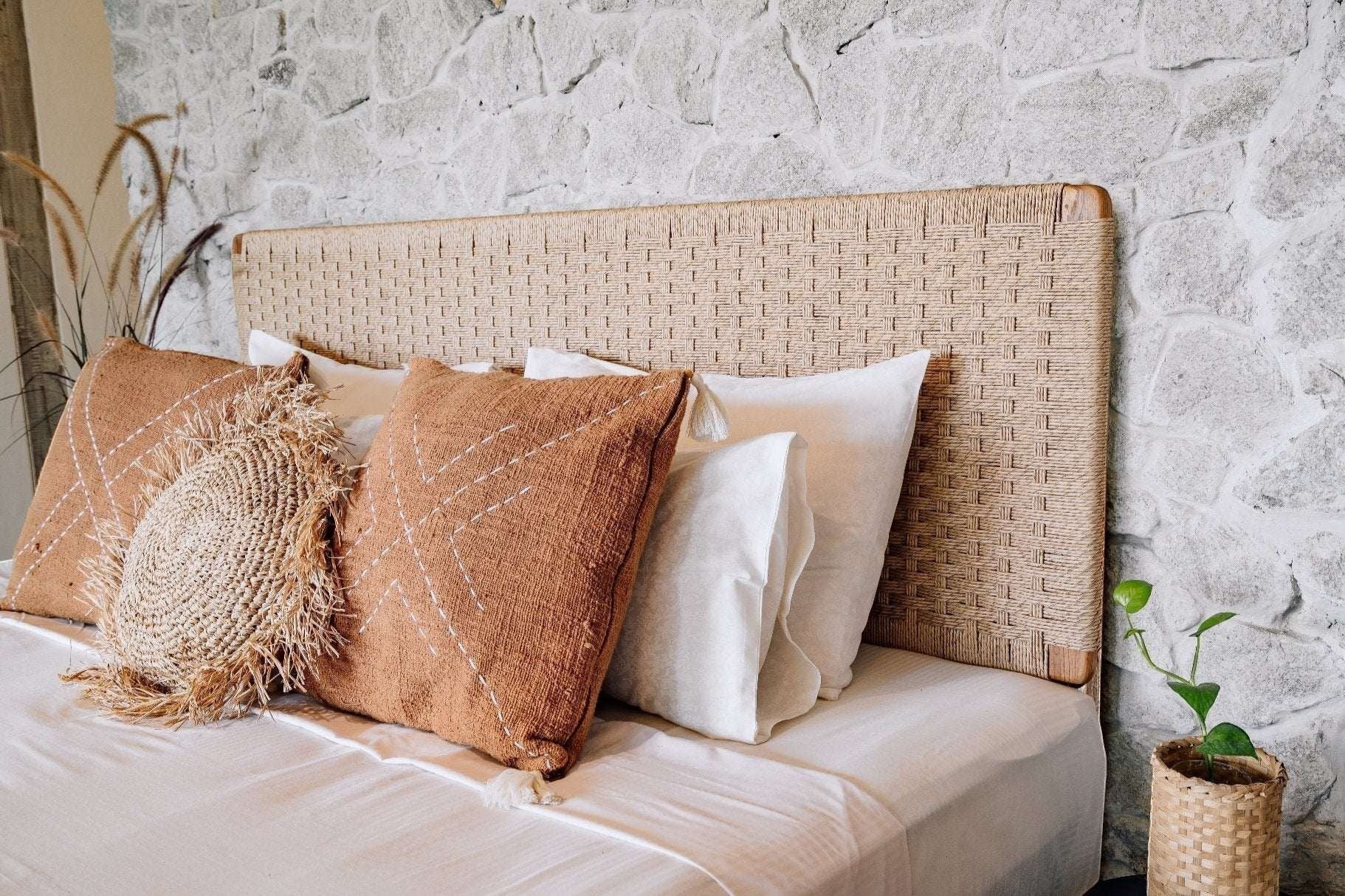 Kayu Living Cemagi handwoven rope headboard with solid teak frame, natural finish. Adds texture to bedroom.
