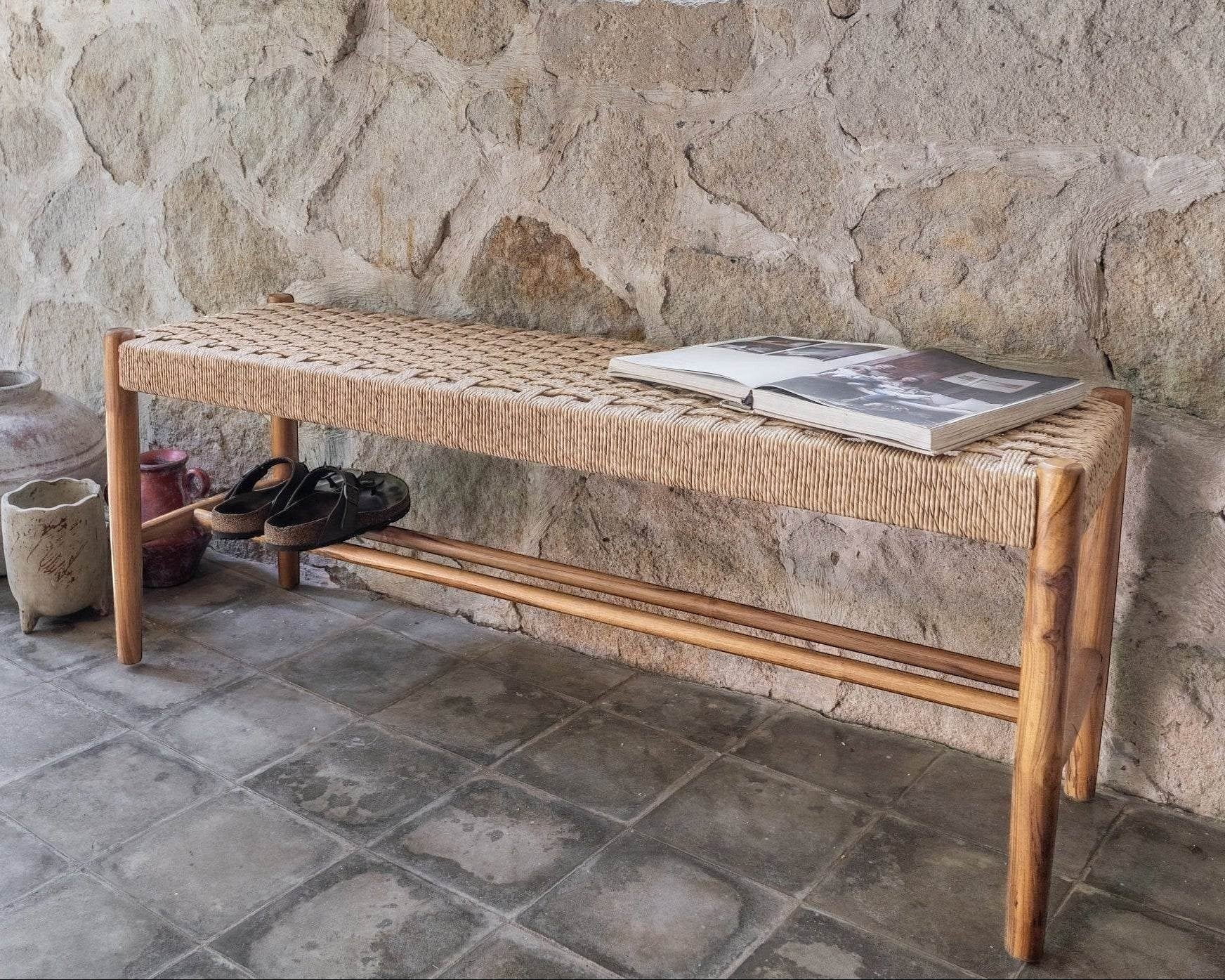 Kayu Living Cemagi 120 cm teak bench with handwoven rope seat and shoe rack below.