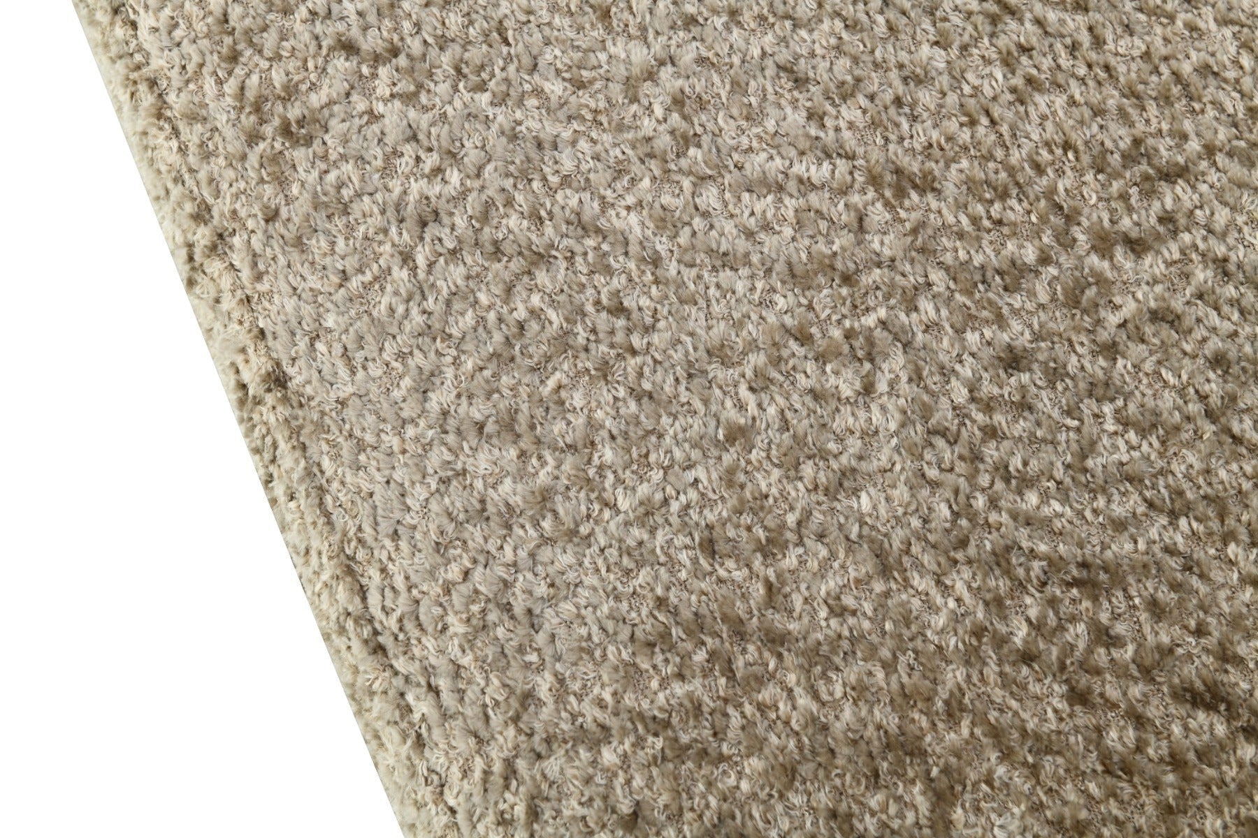 Close-up of the Kayu Living Dilan Venga Liver rug featuring a textured, beige shaggy pile surface.