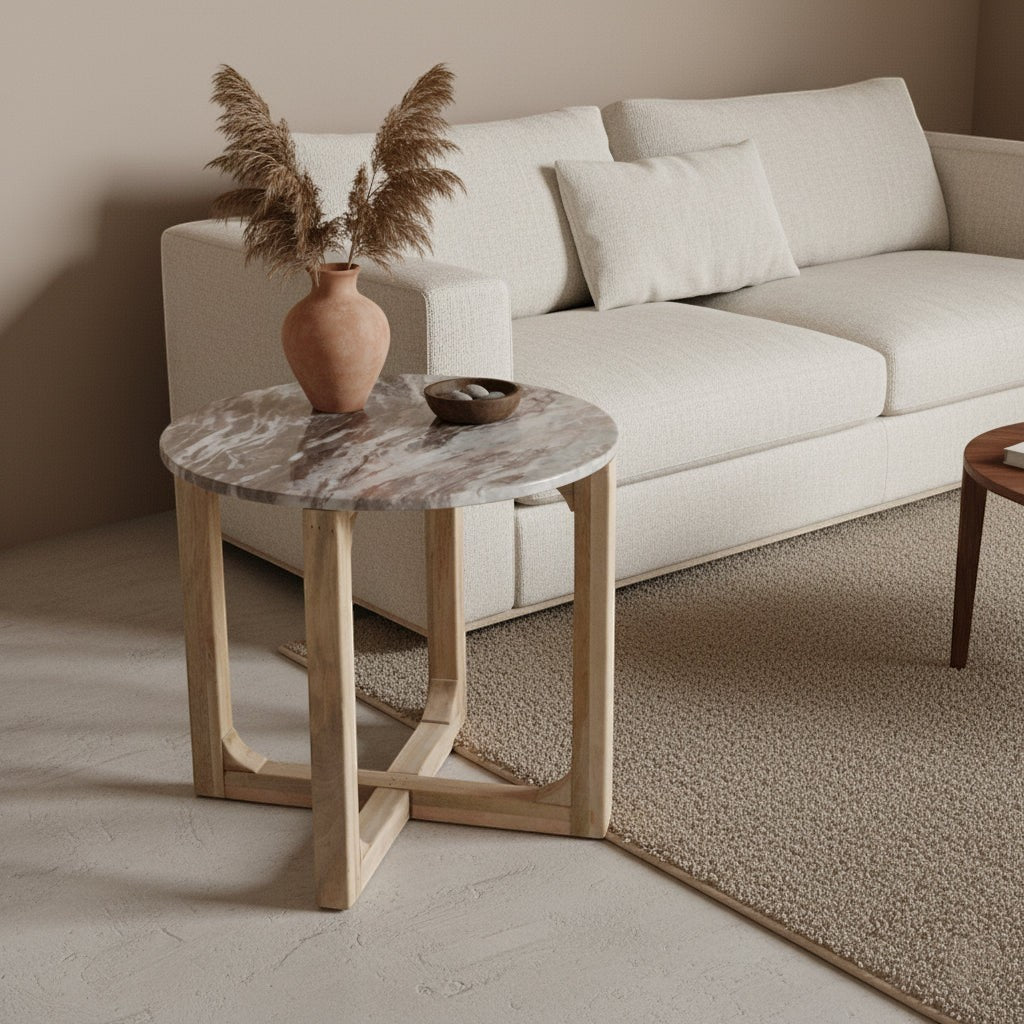 Kayu Living round Fantasy Brown marble side table with natural mango wood base in a modern living room setting.