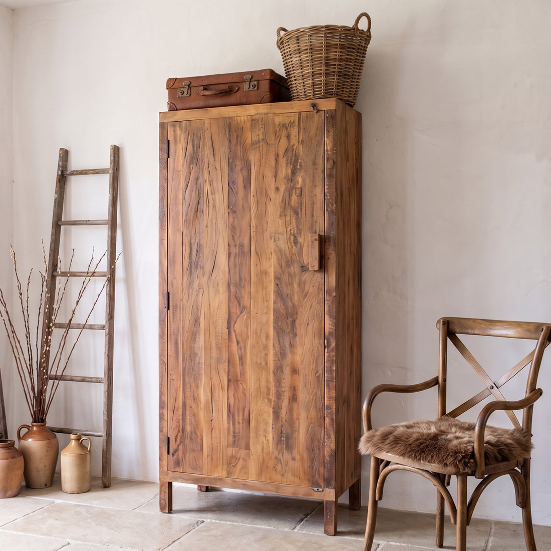 Kayu Living Farmwood cabinet made of rustic FSC-recycled wood with a single door, standing in a cozy room setting.