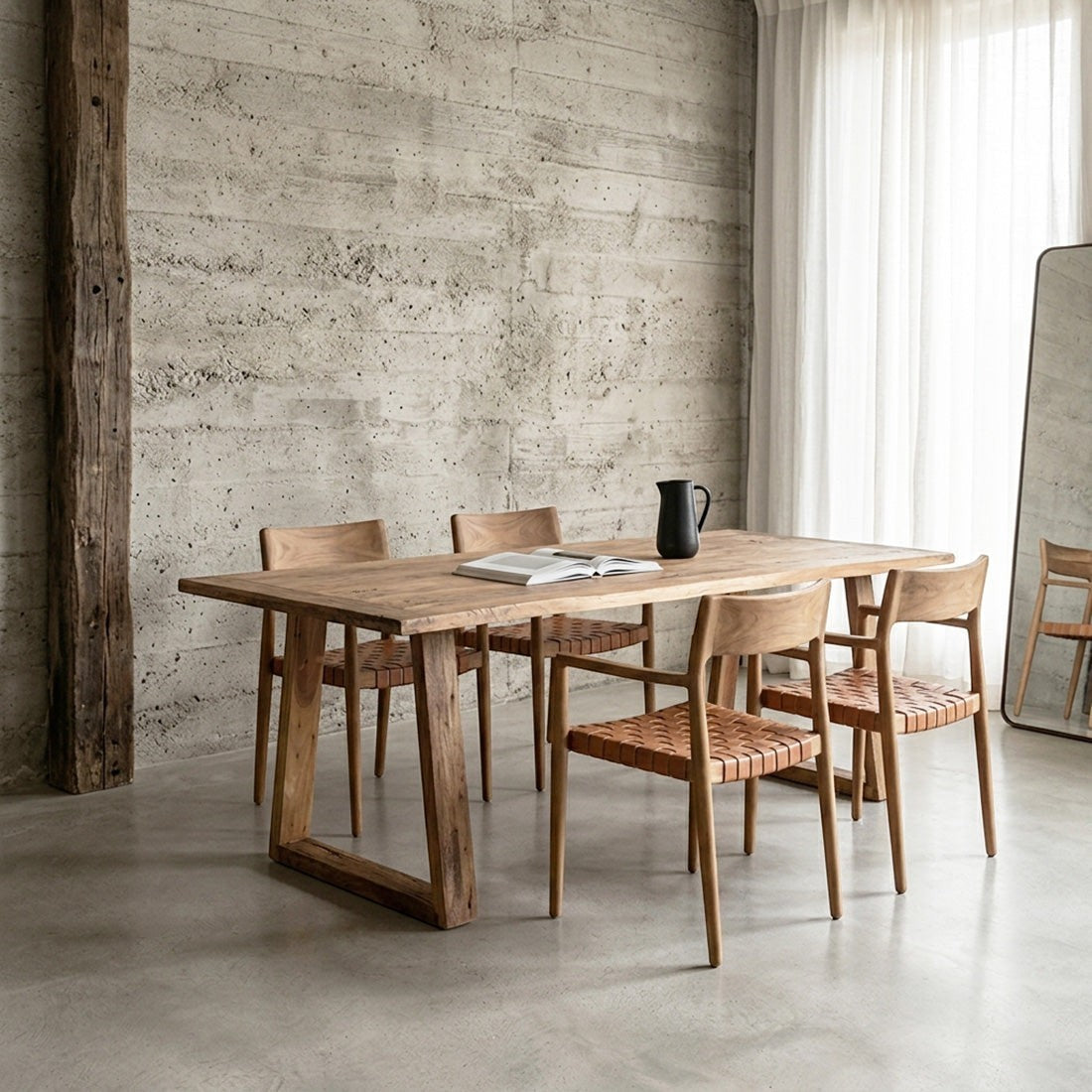 Kayu Living Farmwood dining table in brown recycled wood with natural grain, paired with woven leather chairs.
