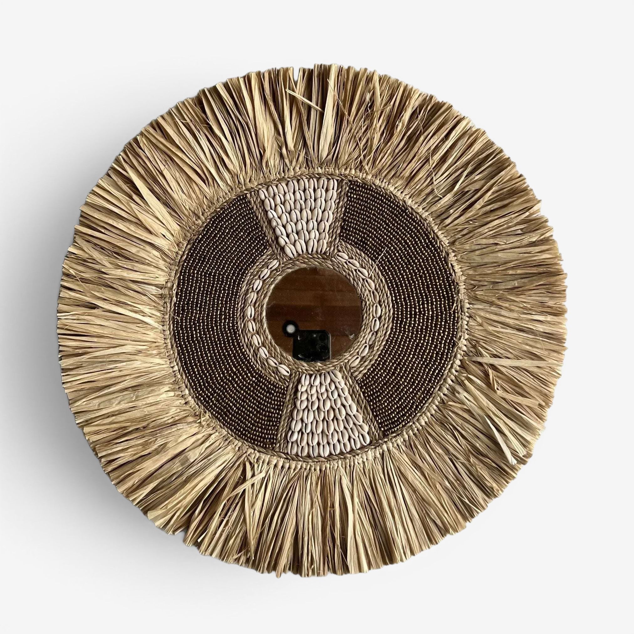 Kayu Living gold beaded shell and seagrass mirror decor with fringe detail. Coastal boho wall art.