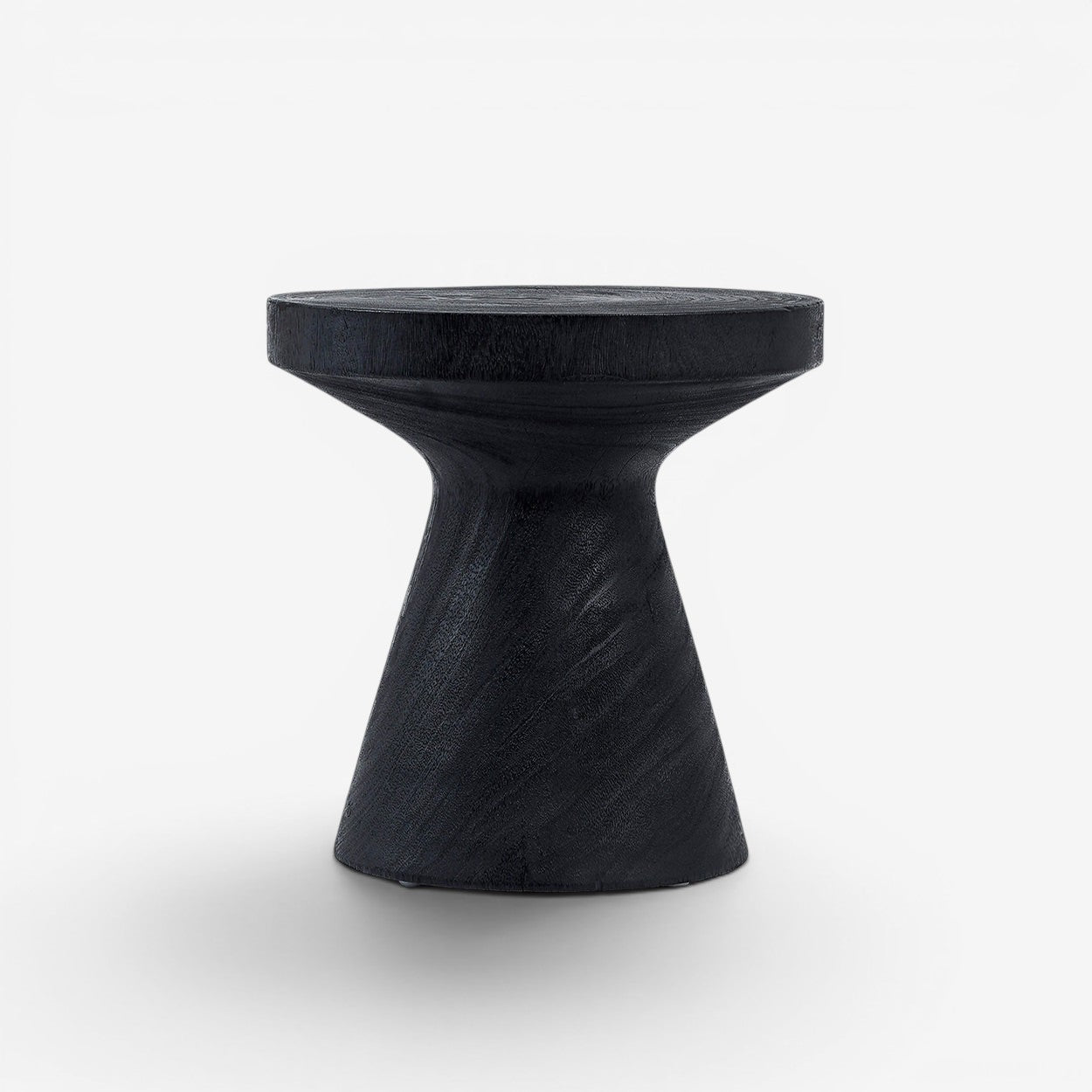 Kayu Living Gravity Side Table in black suar wood. Modern, hourglass-shaped accent table with a smooth finish.