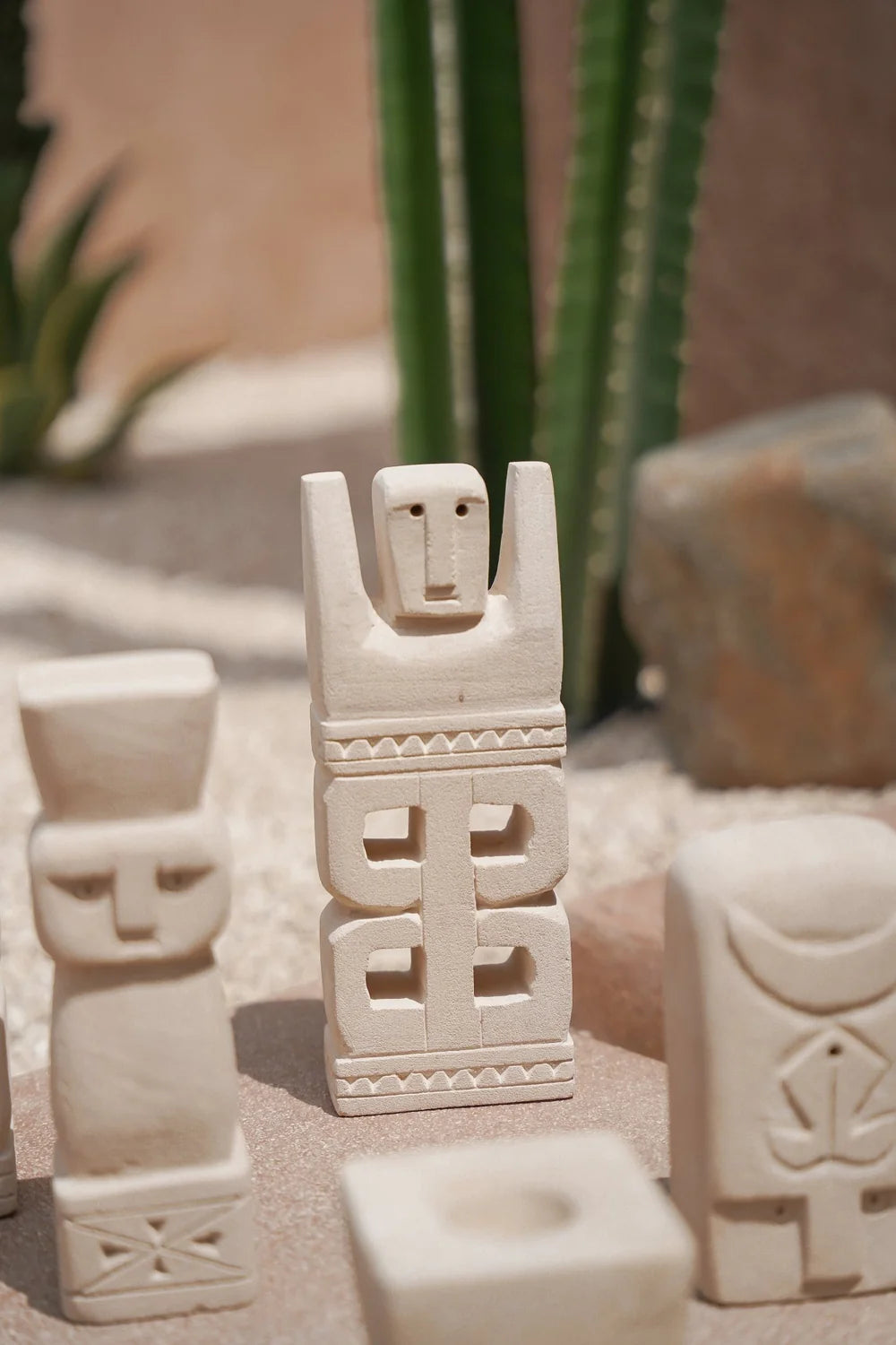 Kayu Living handmade Balinese stone guardian figurine with natural finish and carved geometric details