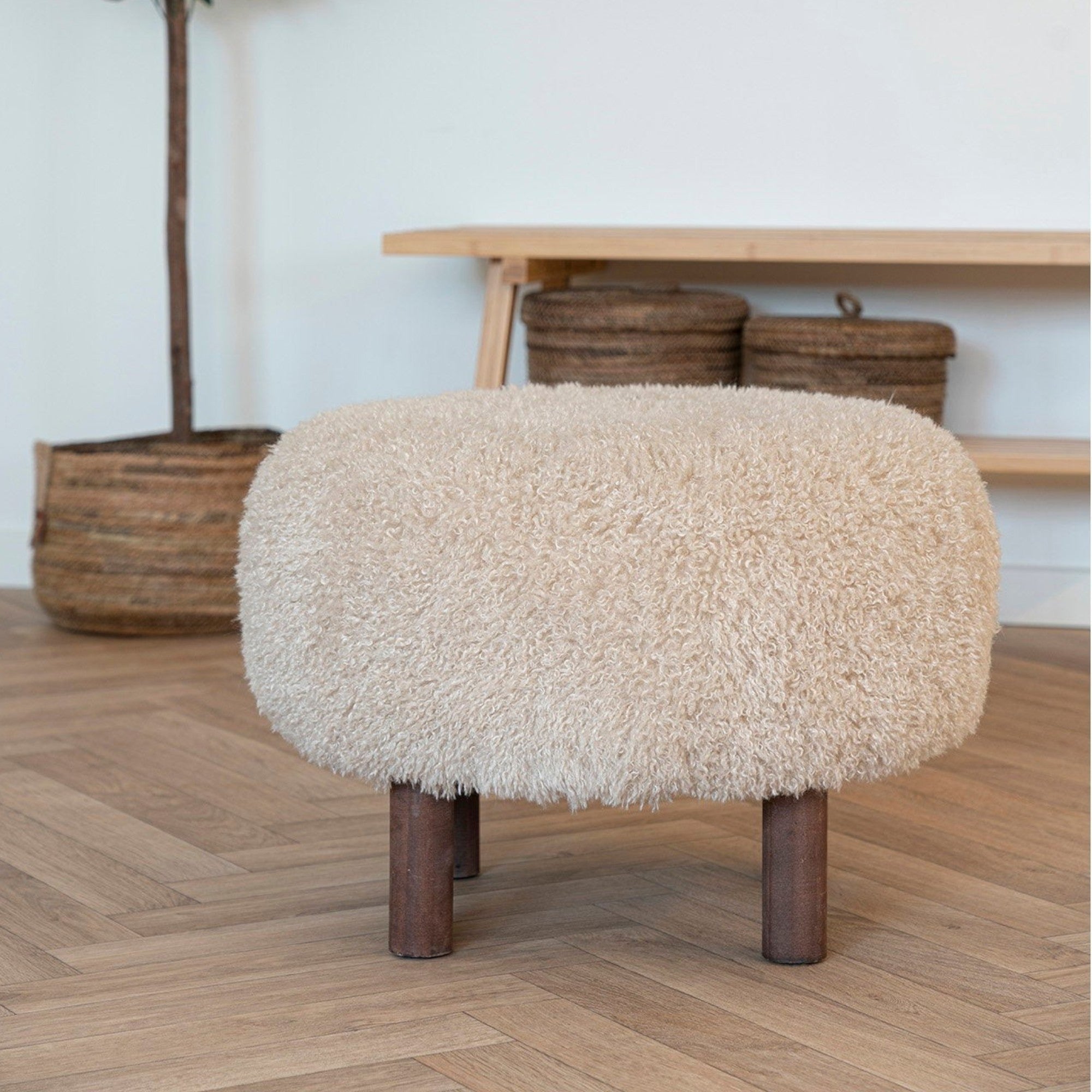 Kayu Living Inverness Pouf, cream boucle upholstery, round shape, four short wooden legs. Versatile as seating or footrest.