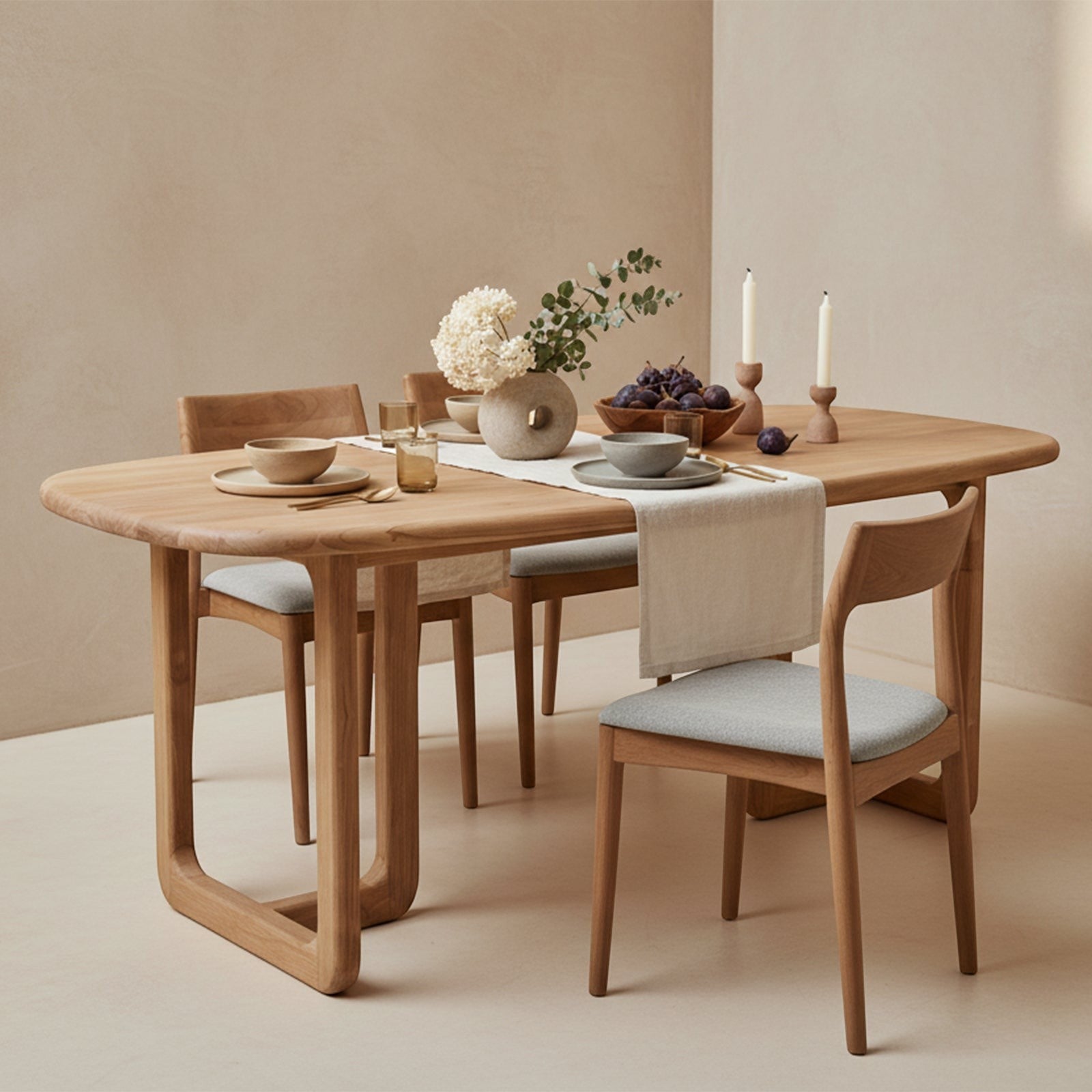 Kayu Living Invierno rectangular dining table in recycled teak wood with rounded corners and organic base design.