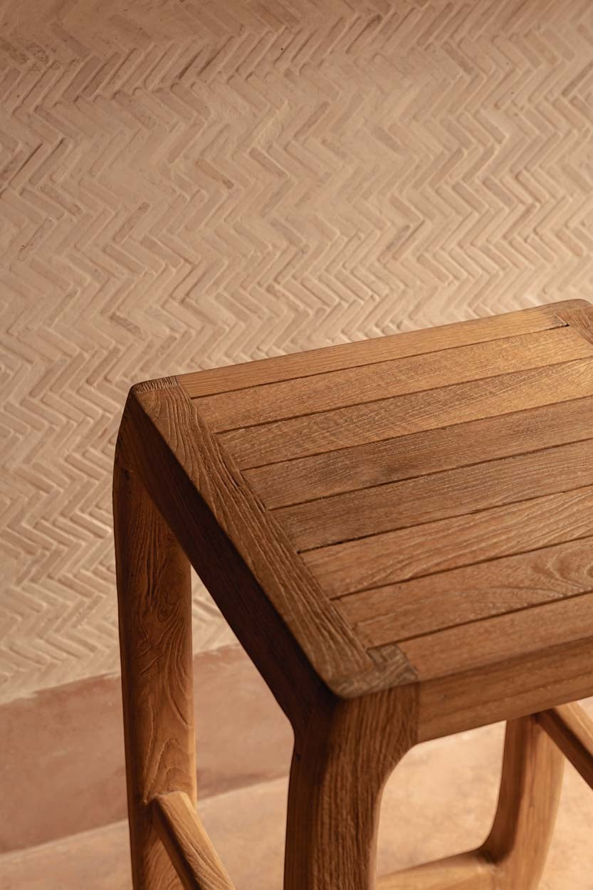 Kayu Living Ithaca bar stool made of natural recycled teak wood with a durable, weather-resistant finish.
