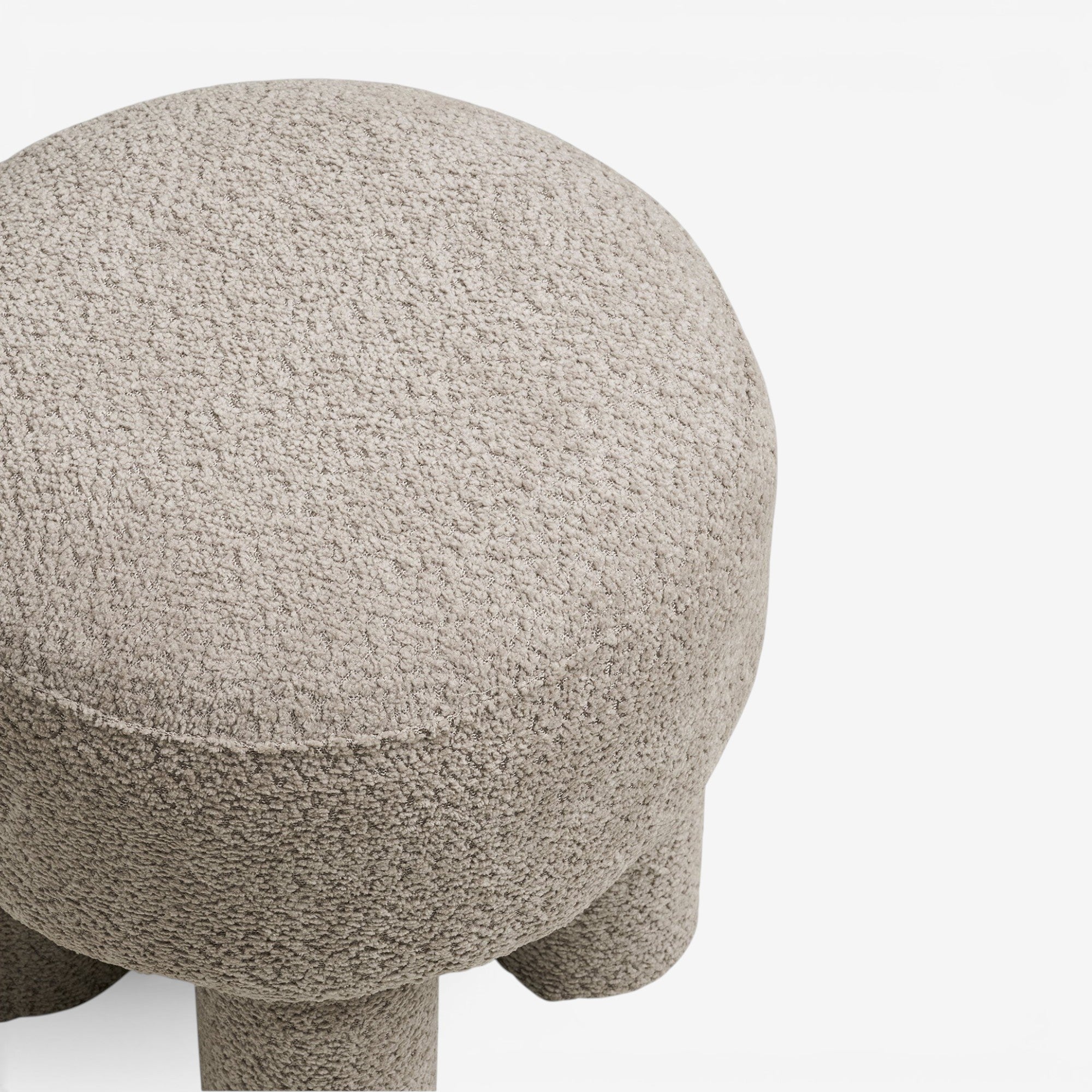 Kayu Living light grey polyester pouf with a textured finish, perfect as a footrest or accent seating.