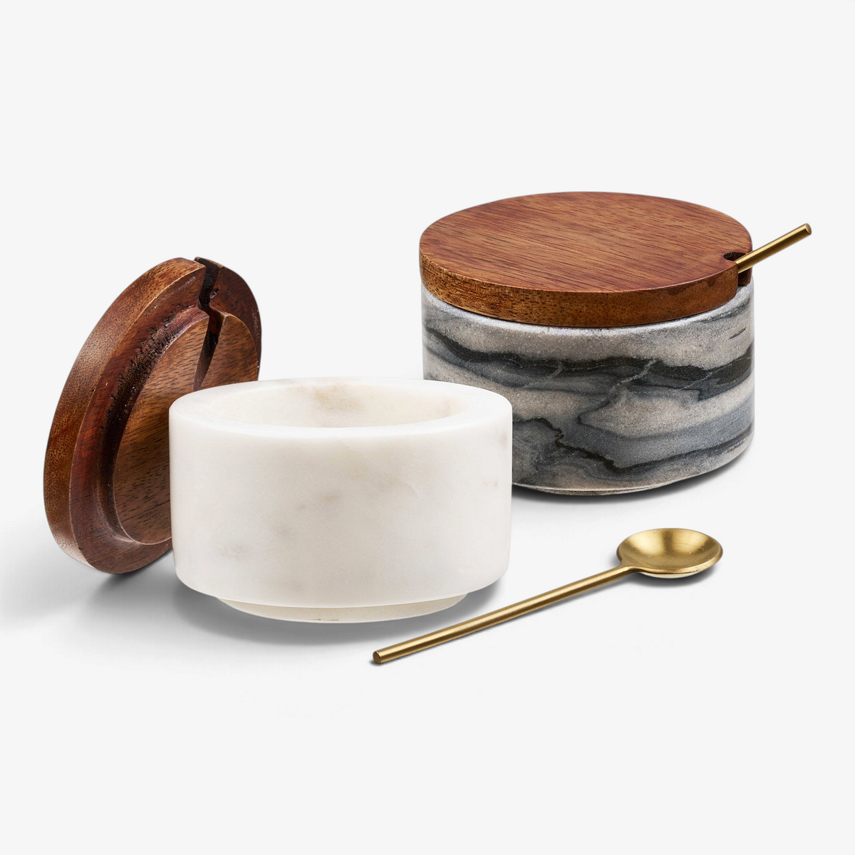 Kayu Living Pauri set of two marble storage jars with wooden lids and brass spoons in grey and white marble finish.