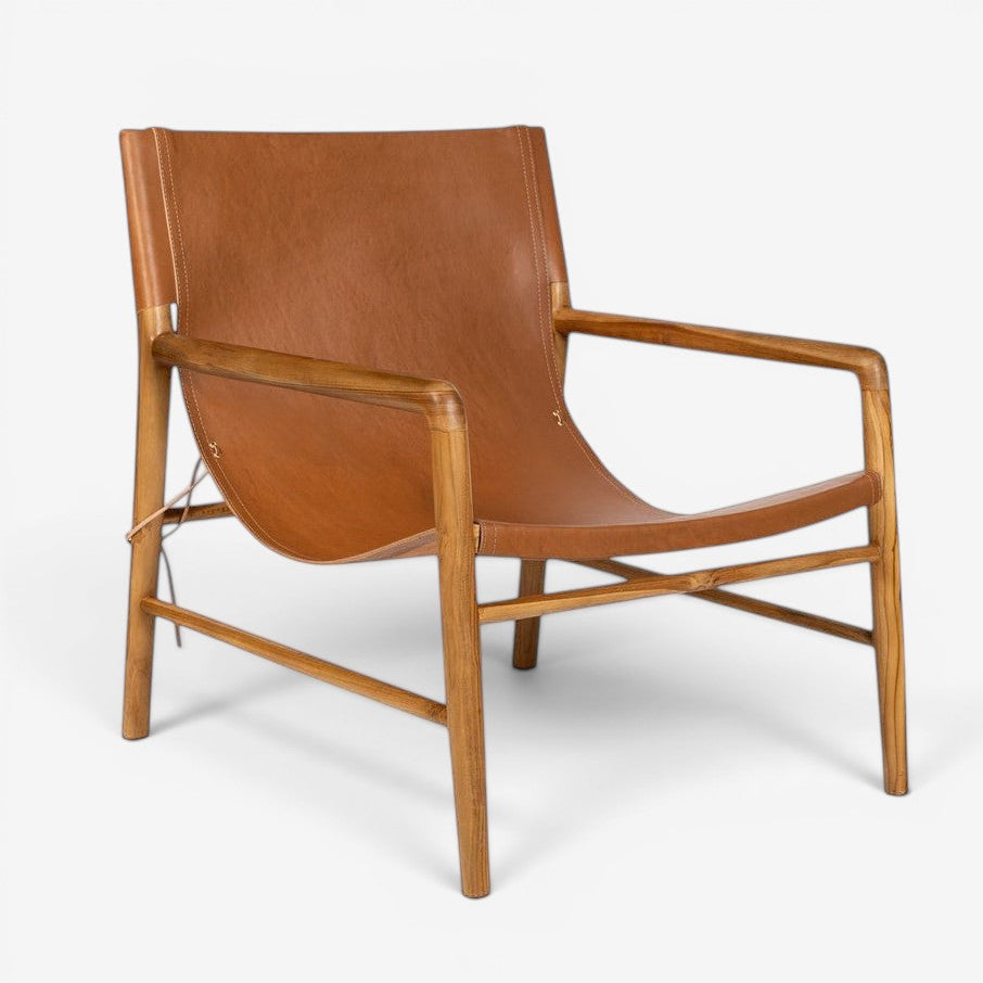 Kayu Living Marita armchair in cognac leather and teak wood frame with a minimalist design.