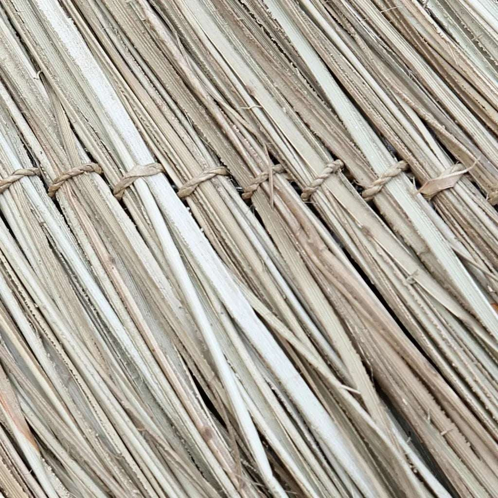 Kayu Living handwoven mendong grass pendant lamp with natural texture and warm tones.