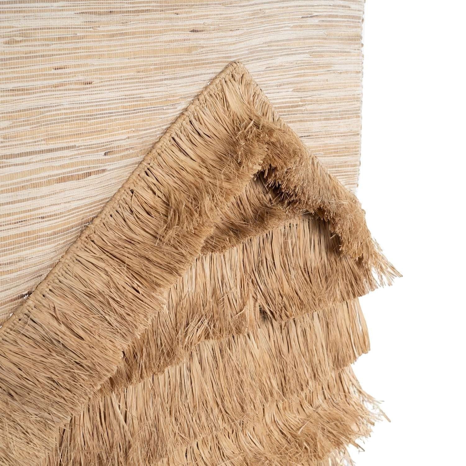 Kayu Living natural sisal wall hanging with layered fringe detail in a neutral beige tone.