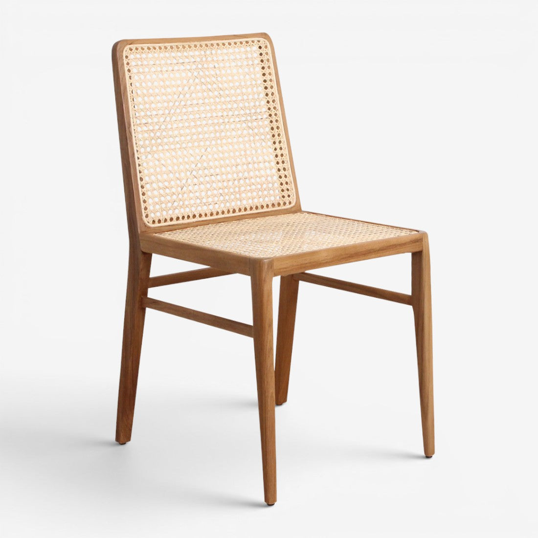 Kayu Living Nova teak dining chair with a natural wood frame and hand-woven rattan seat and backrest.