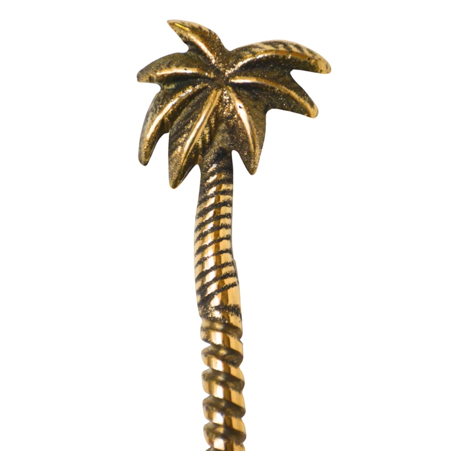 Kayu Living handcrafted gold brass spoon with a detailed palm tree handle design for a bohemian table setting