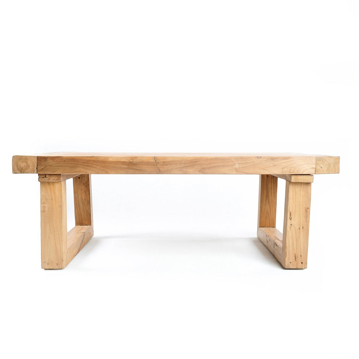 Kayu Living reclaimed teak wood coffee table with a natural finish and sturdy block legs on a white background
