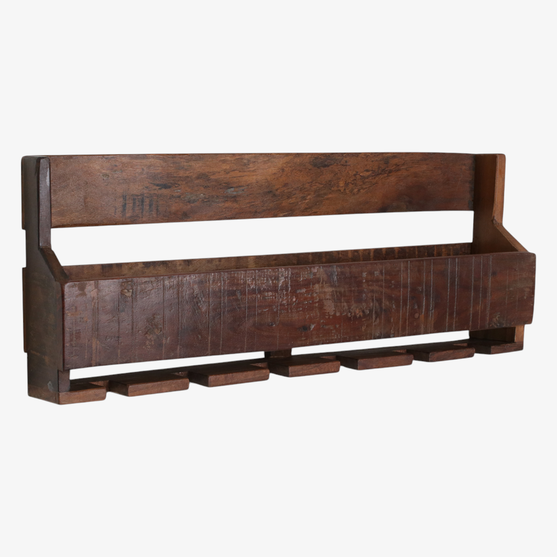 Kayu Living industrial hanging wine rack made from dark reclaimed FSC-recycled wood with under-mounted glass slots.