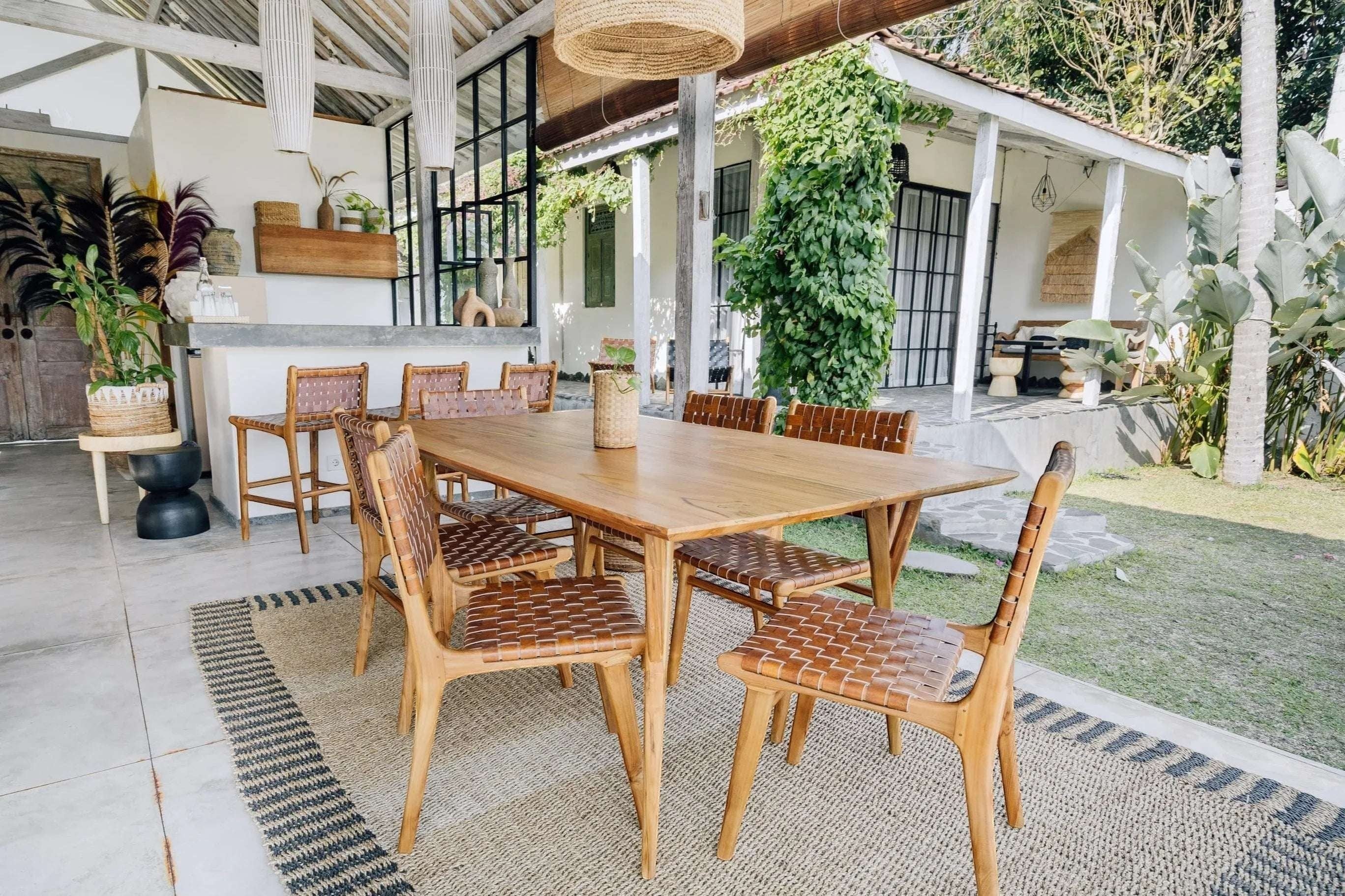 Kayu Living Sanur dining chair with hand-woven camel brown leather seat and natural teak frame.