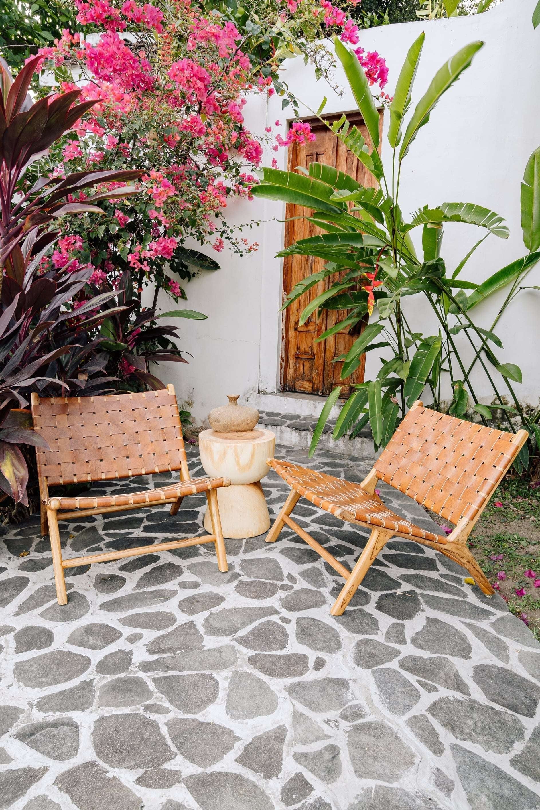 Kayu Living Sanur lounge chair with handwoven camel leather seat and teak frame. Modern, comfortable accent chair.