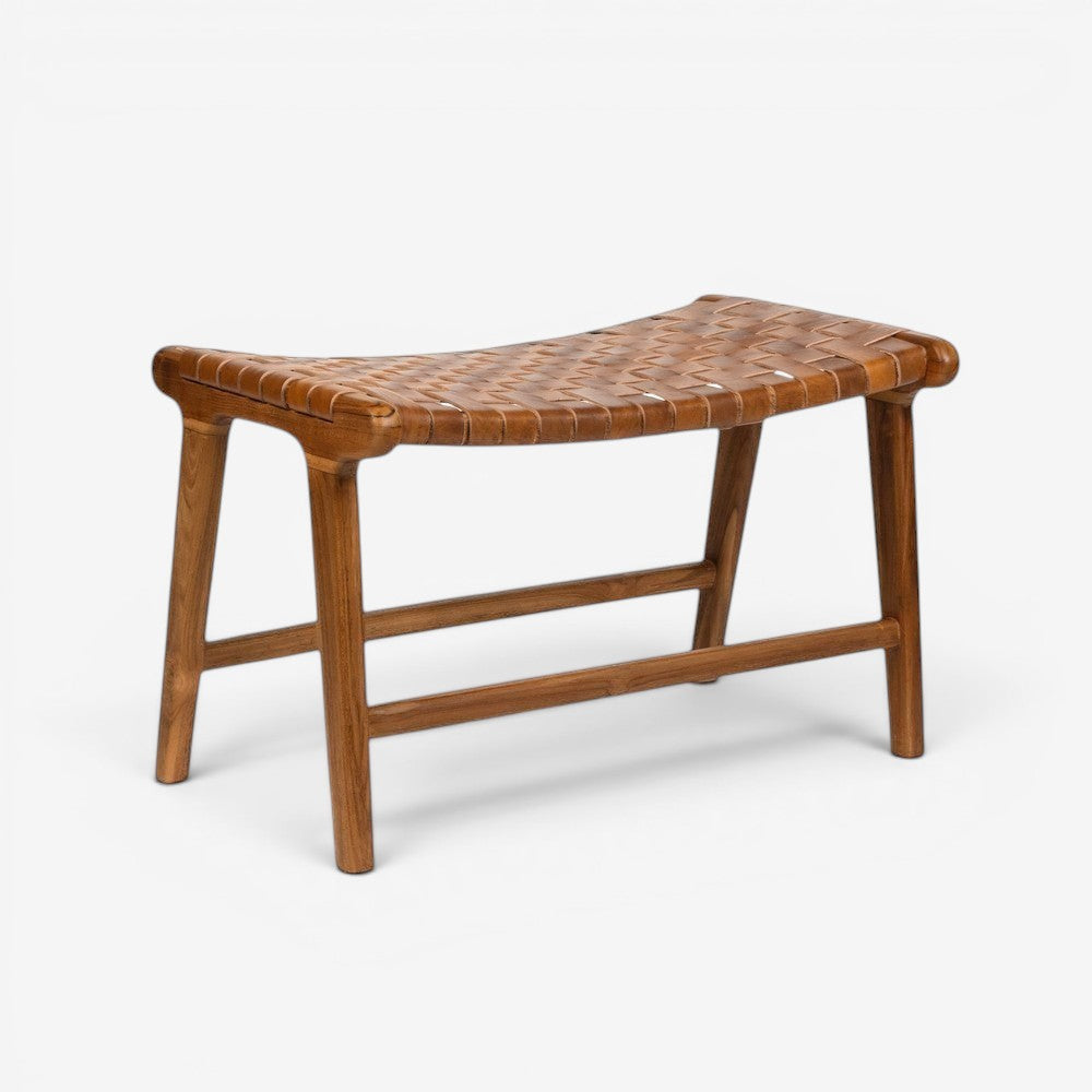 Kayu Living Sanur footstool in camel woven leather and solid teak wood. Curved seat and minimalist frame.