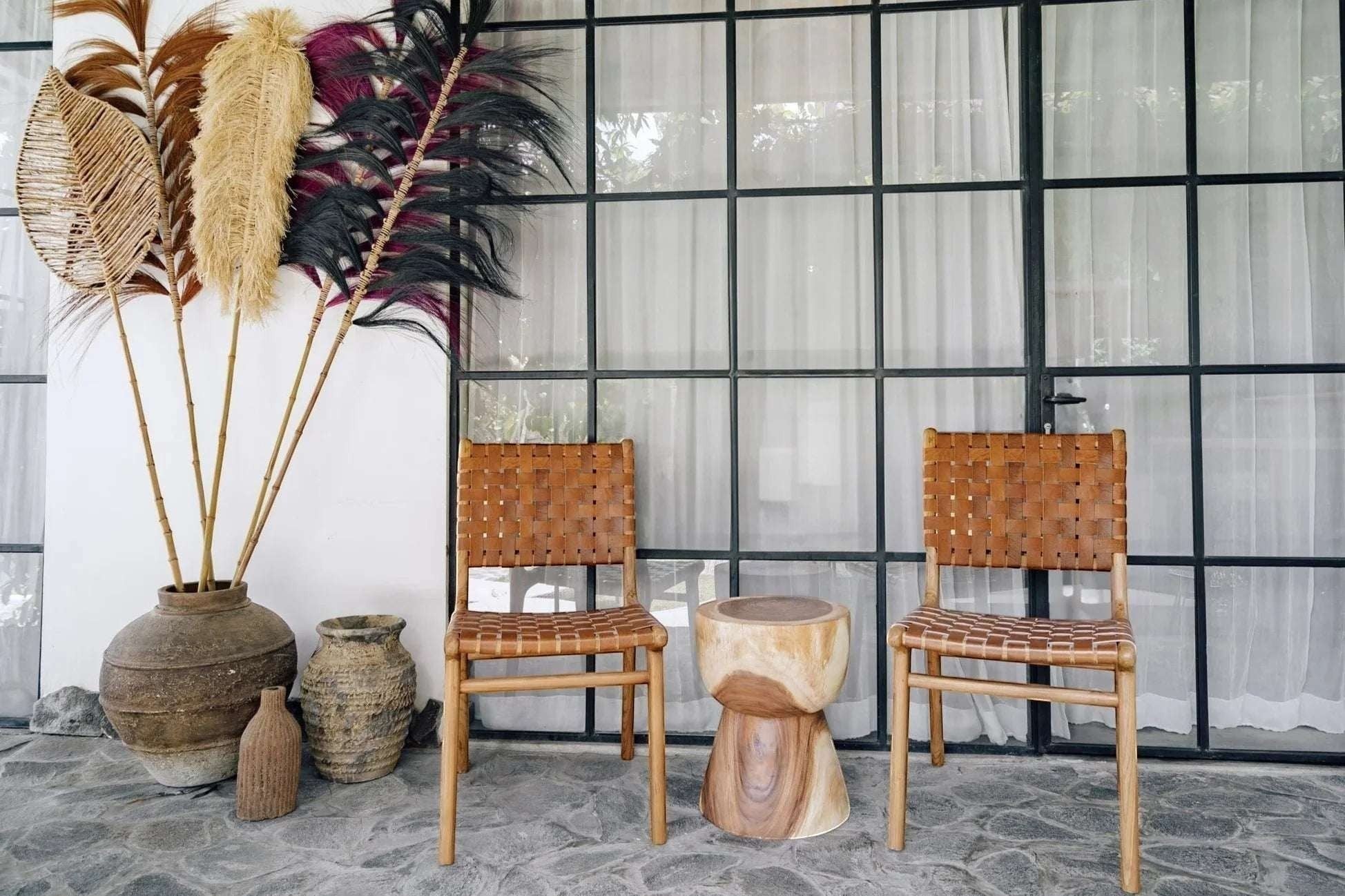 Kayu Living Sanur dining chair with hand-woven camel brown leather seat and teak frame. Modern design with traditional craftsmanship.