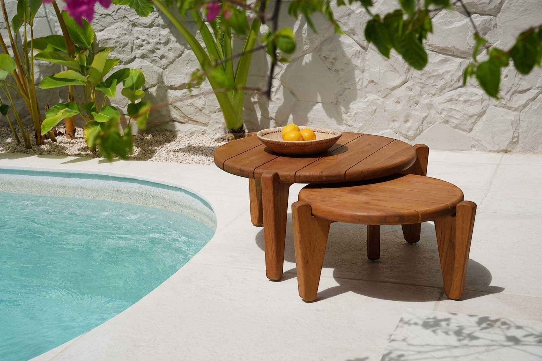 Kayu Living Seseh M outdoor coffee table crafted from reclaimed teak with a distinctive three-leg silhouette.