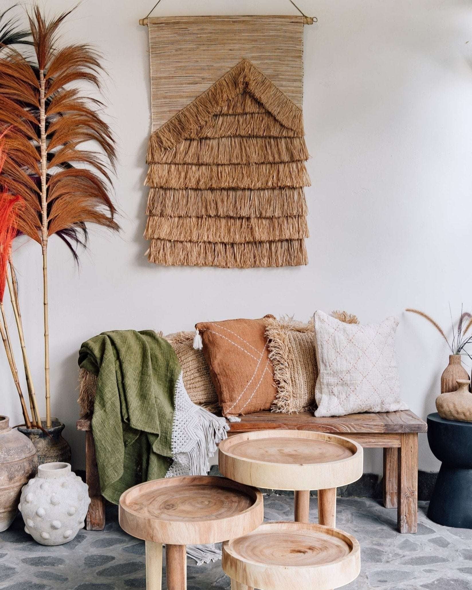 Kayu Living natural sisal wall hanging with fringed detail, adding rustic texture to a boho living space.